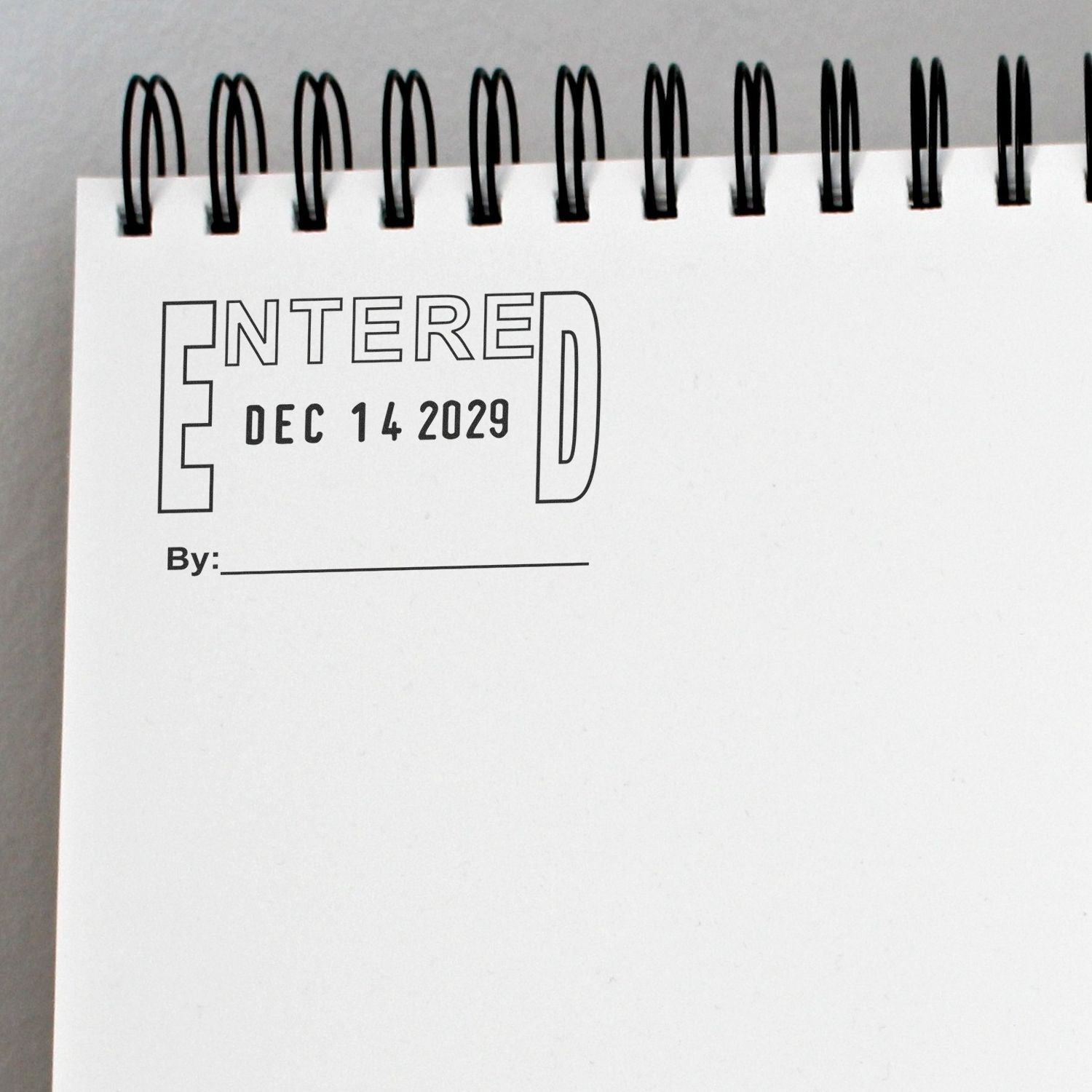 Spiral notebook page with Entered Dec 14 2029 title and blank byline.