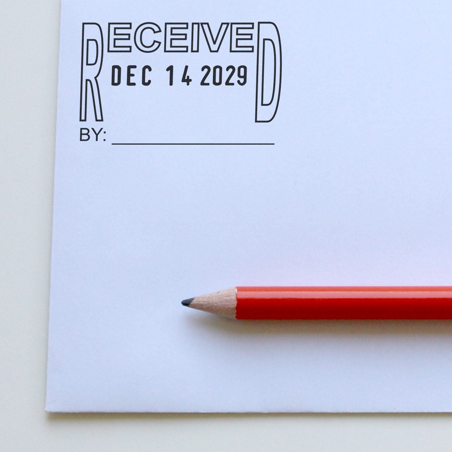 Bullet journal page with decorative Received lettering, Dec. 14, 2029 date, blank byline, and red pencil on white notebook paper.