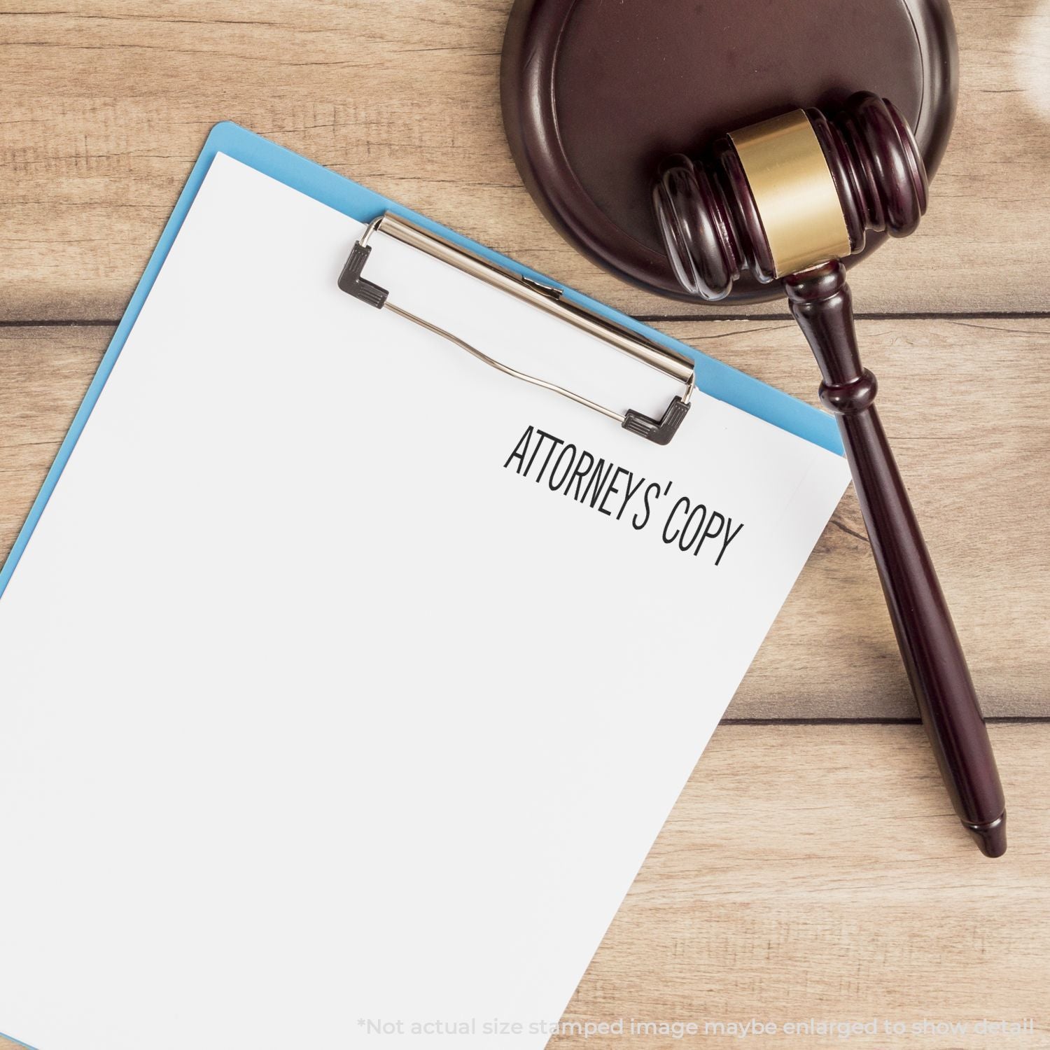 Attorney's copy document on clipboard beside a gavel, highlighting legal document review, stamping, and copying for law firms