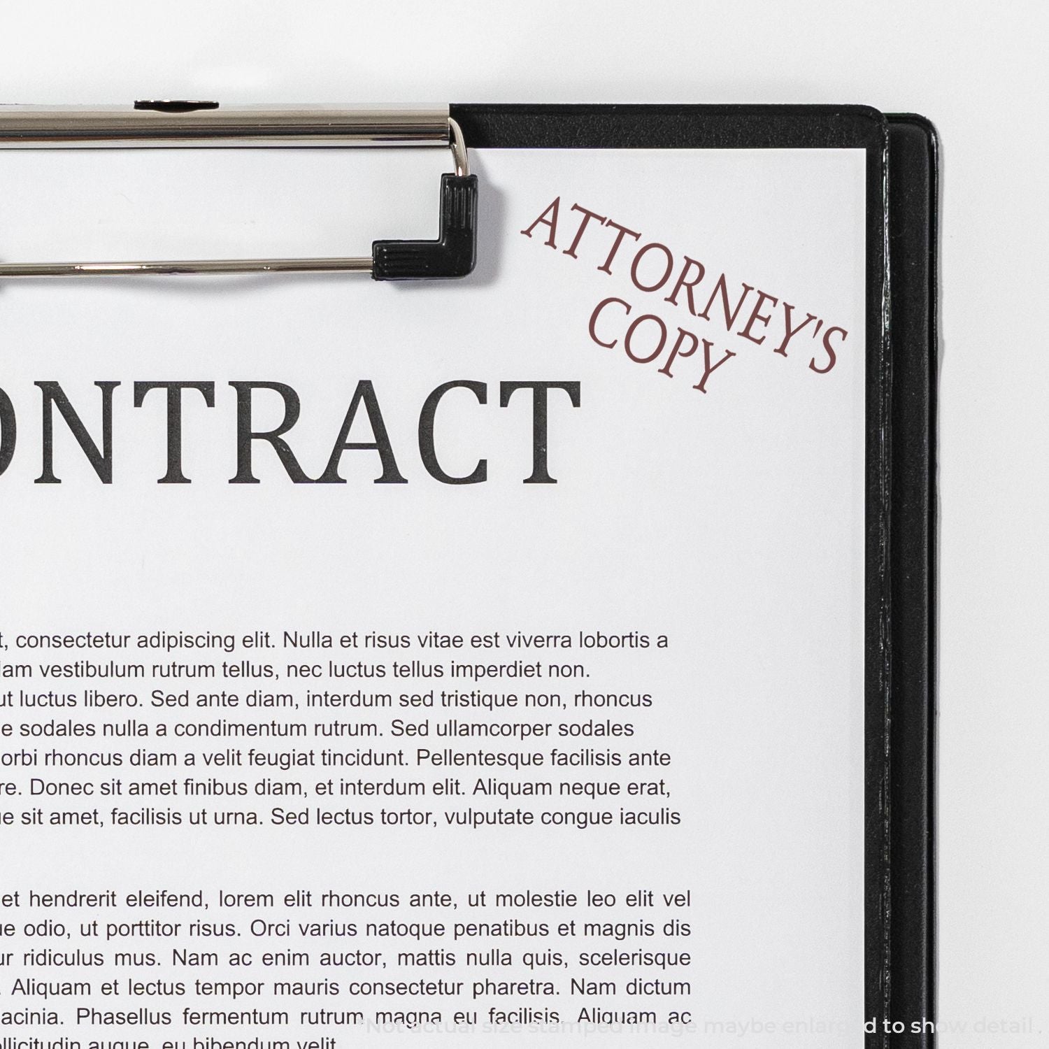 Close-up of contract document on clipboard labeled Attorneys Copy, showing legal paperwork for review and signing.