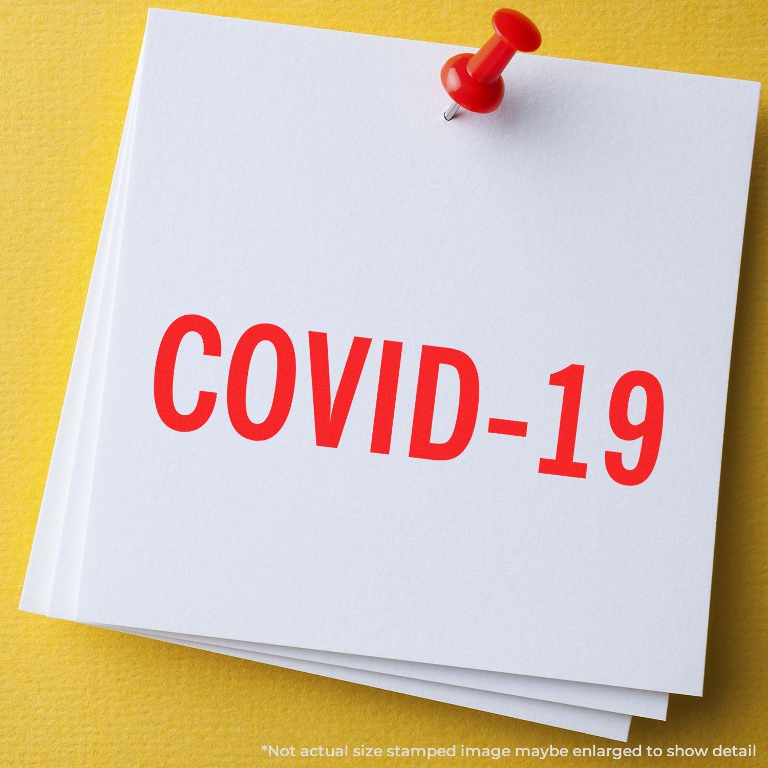 COVID-19 awareness note pinned on a card with red pushpin, highlighting public health information and reminders.