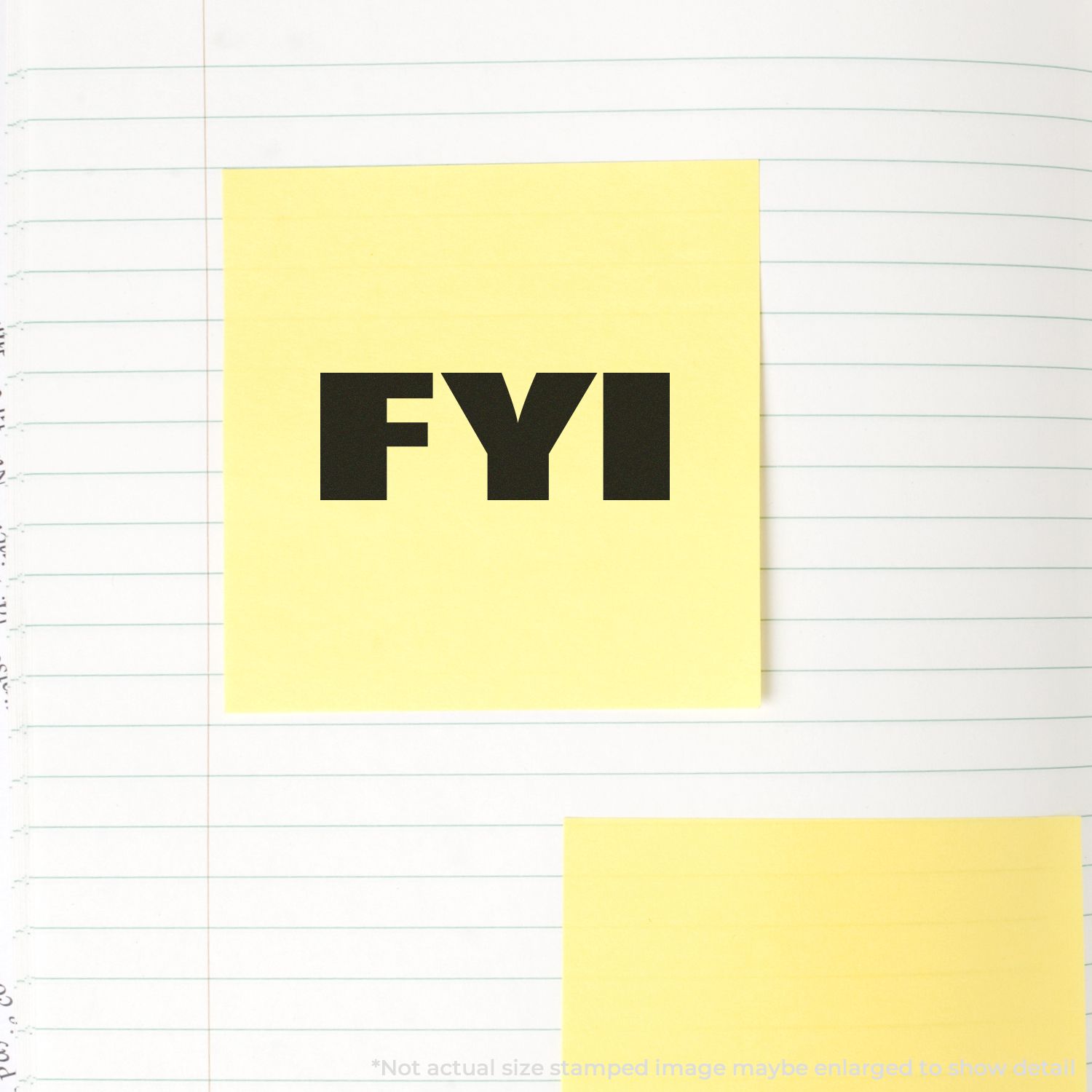 FYI reminder on yellow sticky note placed on lined notebook paper, indicating an informational update or note.