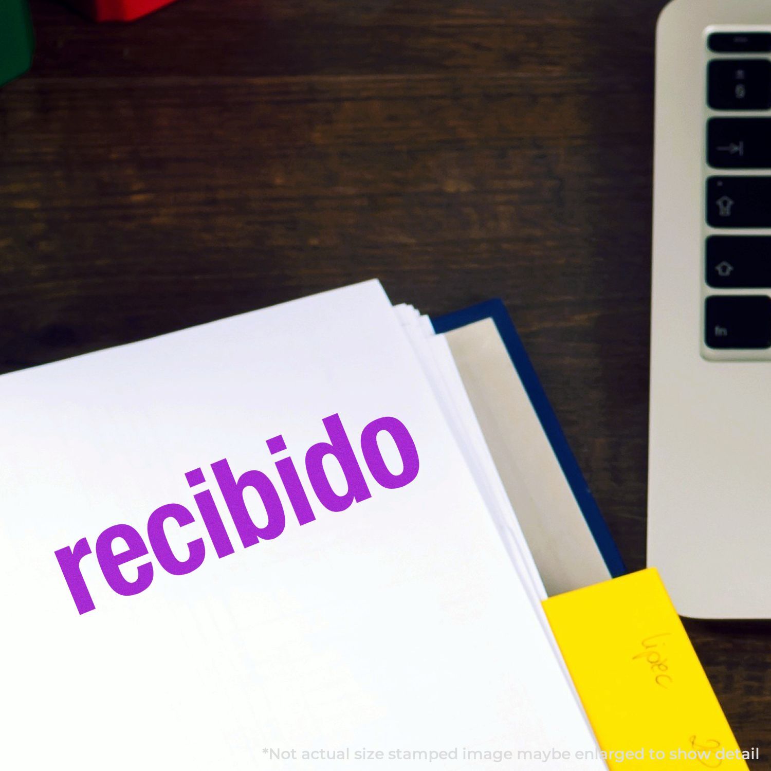 Received package labeled recibido with barcode and delivery slip beside smartphone, showing shipping confirmation.
