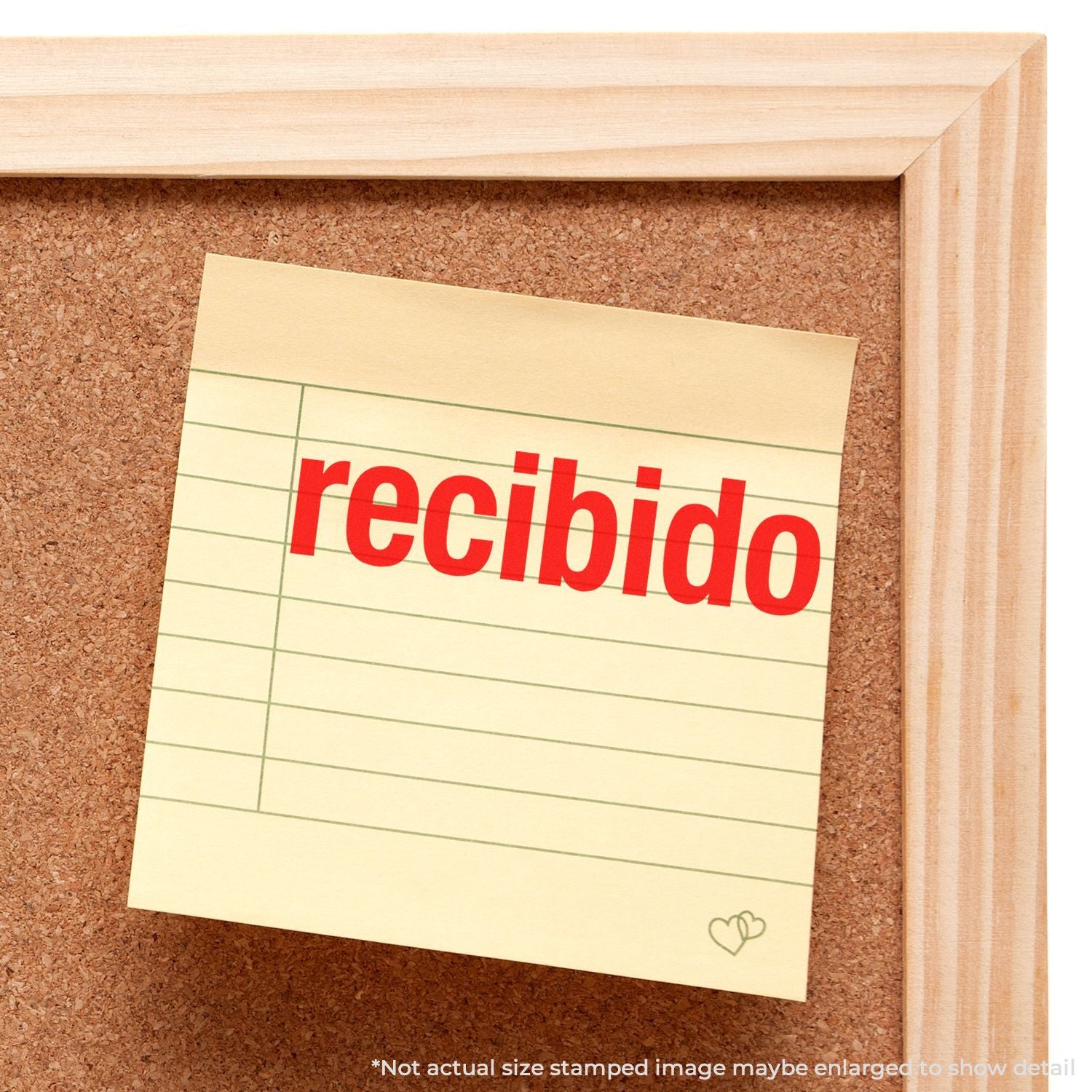 Recibido stamp on a note pinned to a cork bulletin board in a wooden frame.