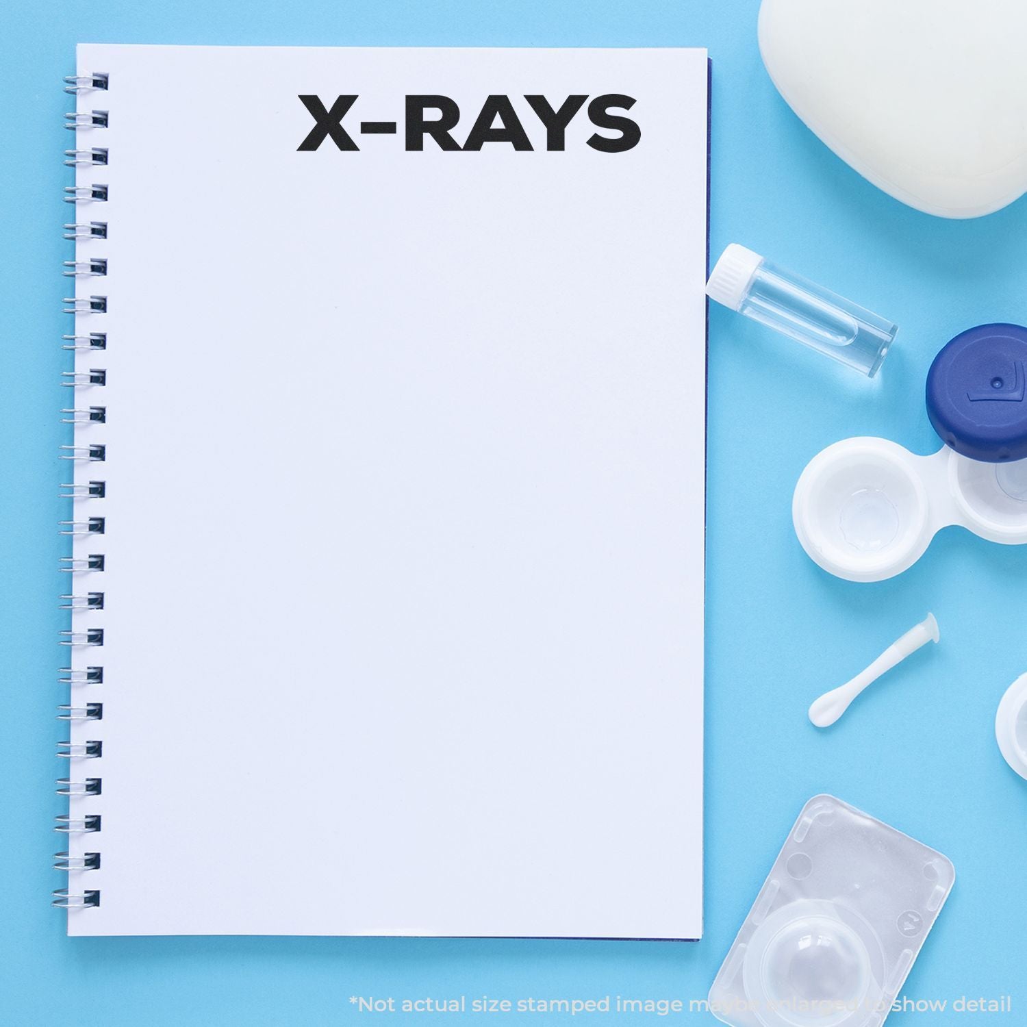 X-RAYS label on medical notebook with dental imaging tools, highlighting diagnostic radiology and dental x-ray testing.