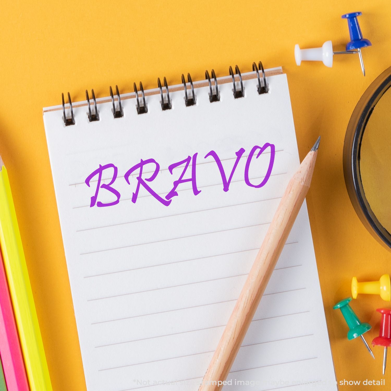 Notebook page with purple BRAIVO lettering, pencil and office suppliesback-to-school creative writing branding concept.