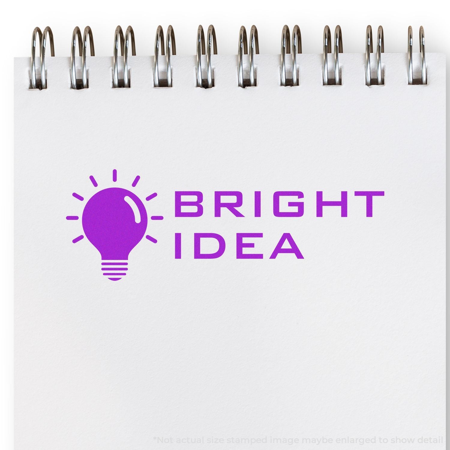Spiral notebook page with purple lightbulb logo and Bright Idea text, symbolizing creative brainstorming and innovation.