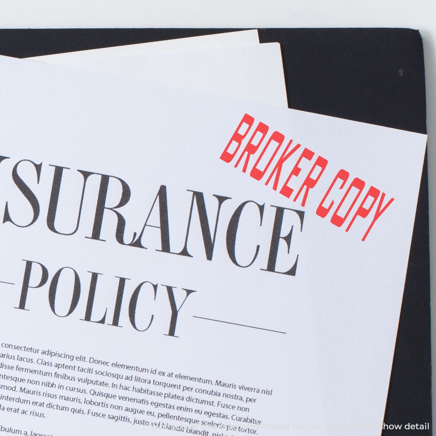 Close-up of branding typography design with red and black text on a printed card or booklet page.