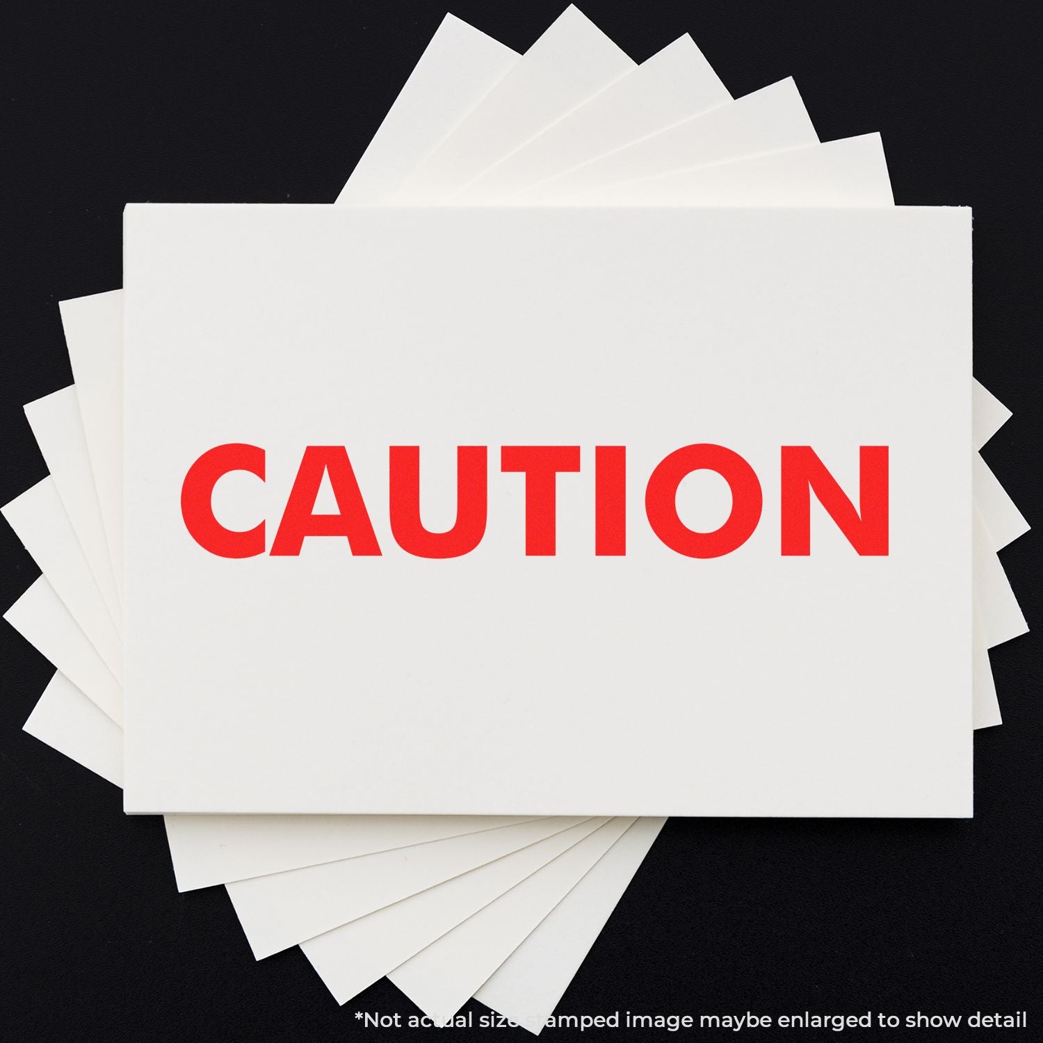 Stacked warning cards with bold red CAUTION text on white paper against a dark background.