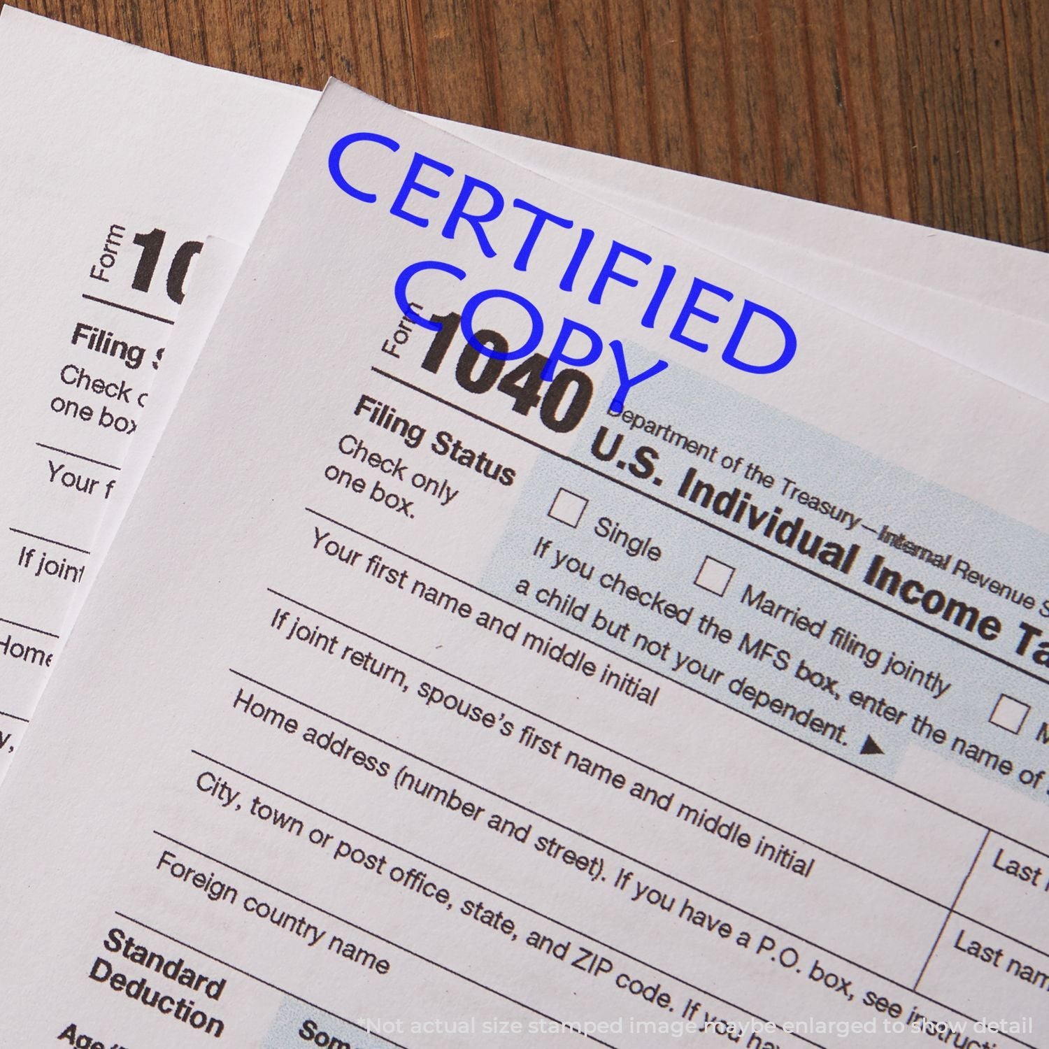Close-up of U.S. Individual Income Tax Form 1040 checklist labeled CERTIFIED, showing filing status options for taxpayers.