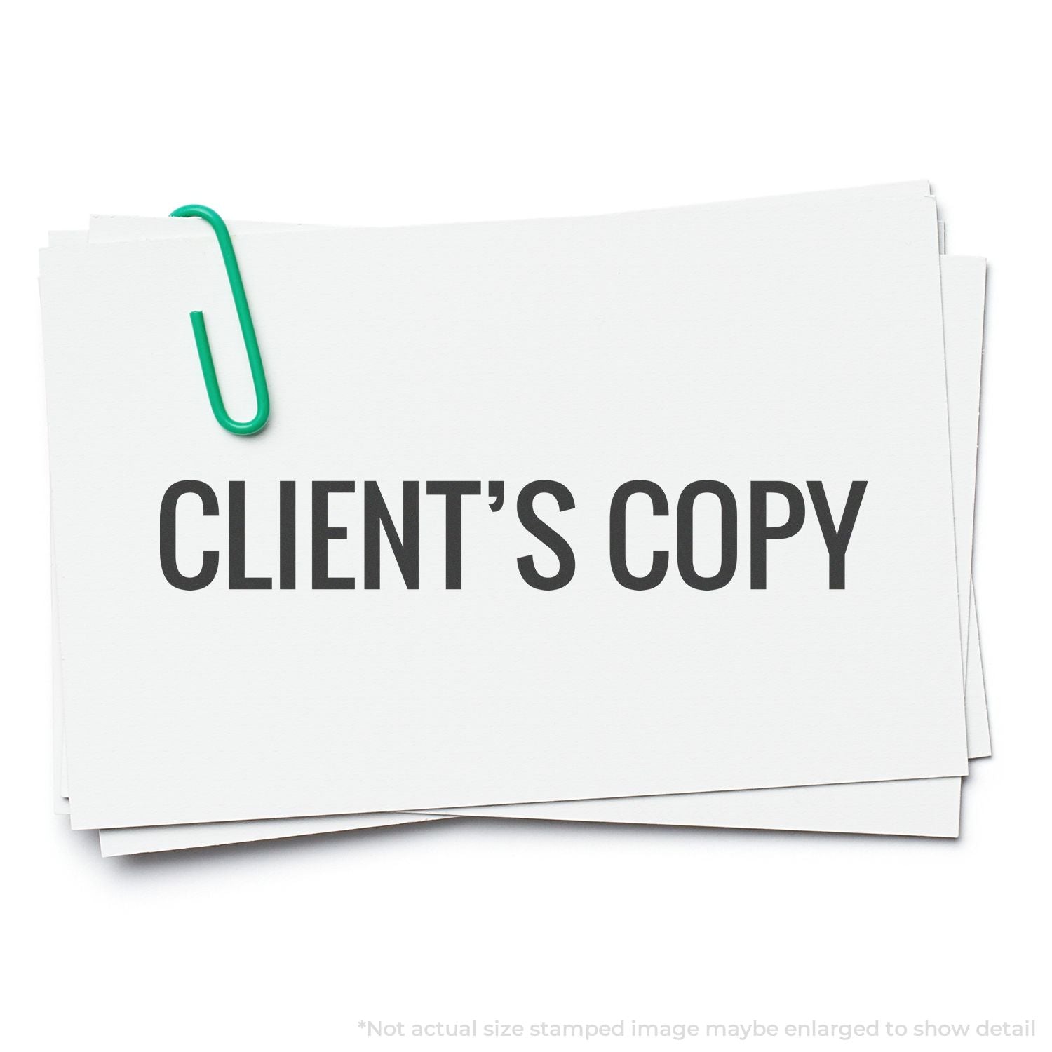White documents stamped CLIENT'S COPY with green binder clip, showing client copy labeling for office legal paperwork records.