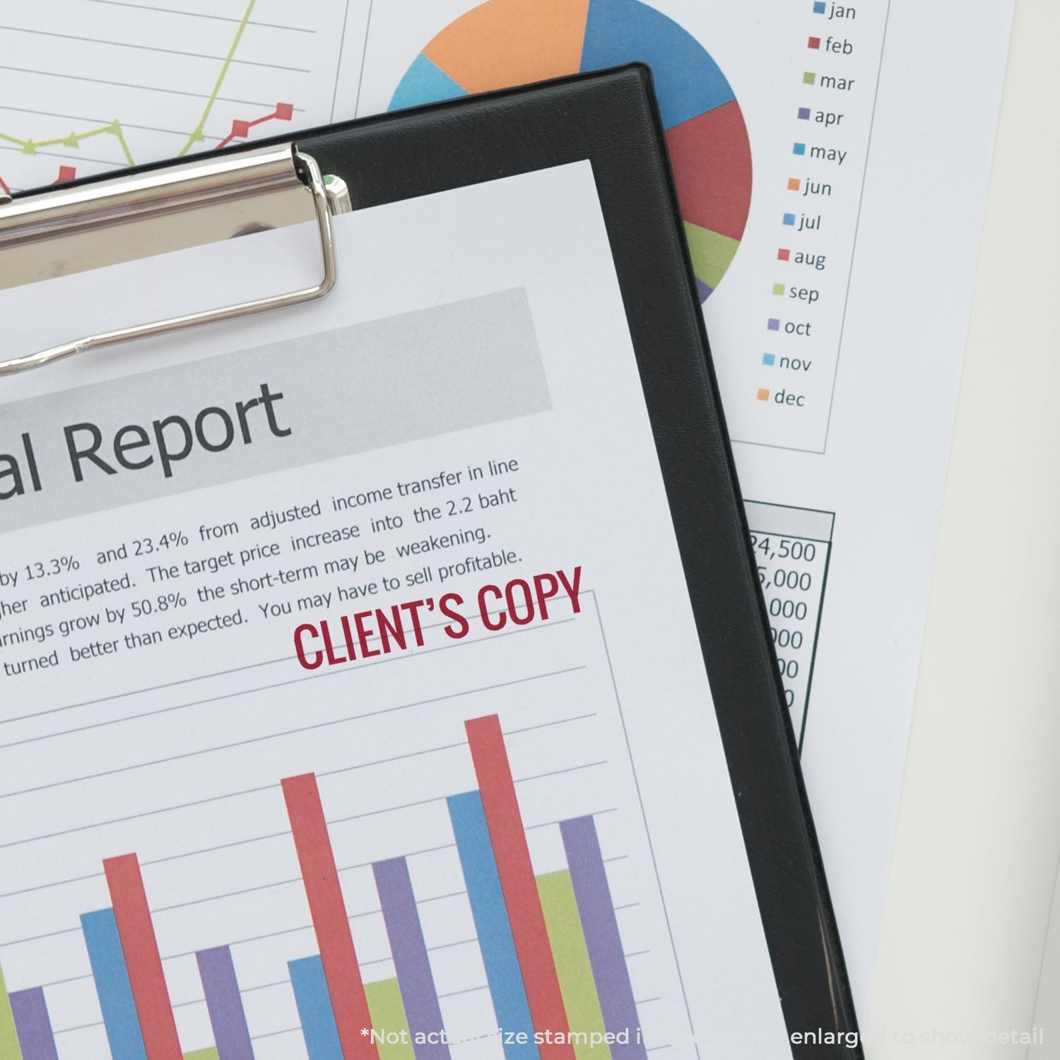 Clipboard with financial report, business charts, and client copy on desk for accounting and analytics review