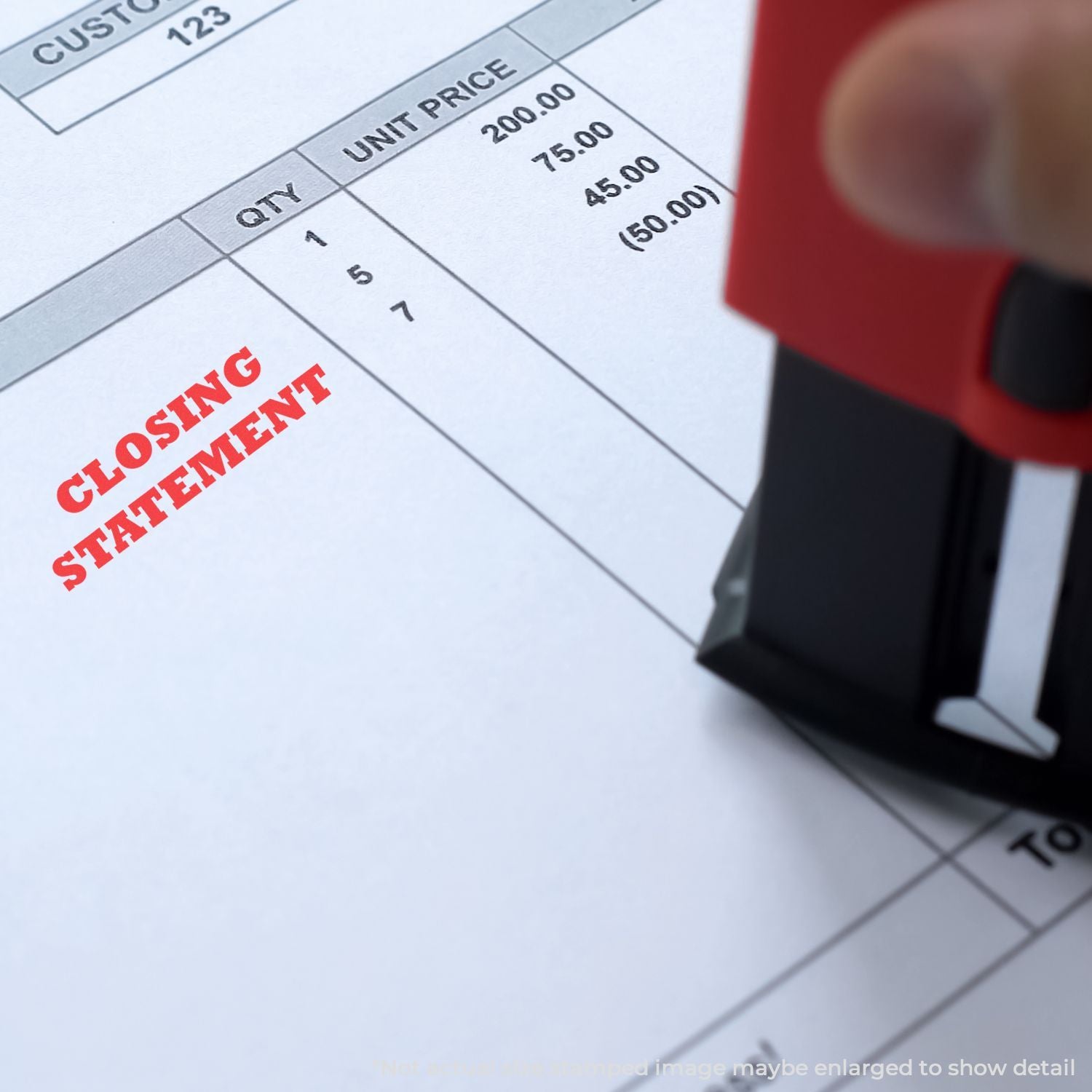 Close-up of a closing statement stamped on an invoice with quantity and unit price columns, representing accounting and financial billing.