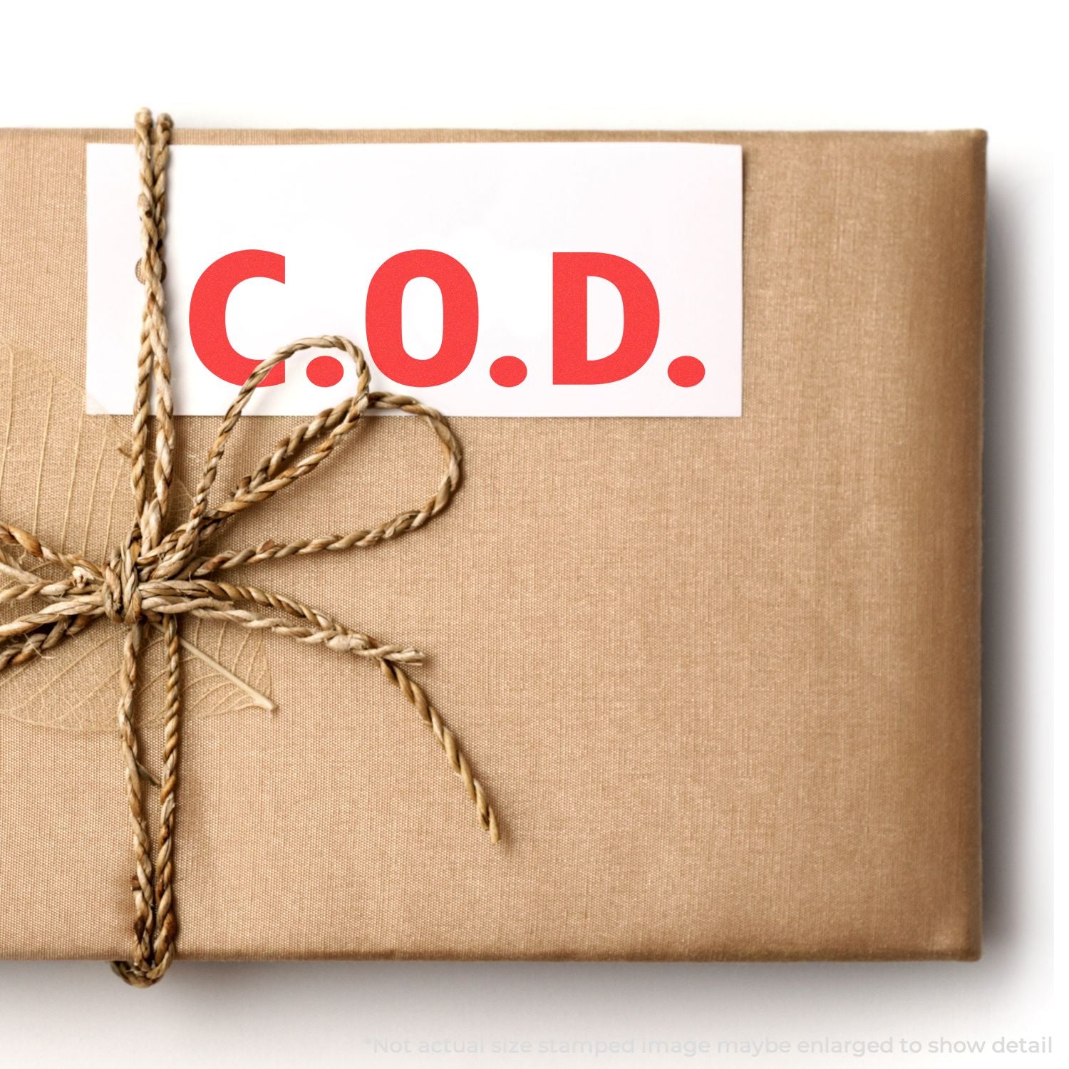 Rustic gift-wrapped parcel with twine and C.O.D. label on kraft paper package