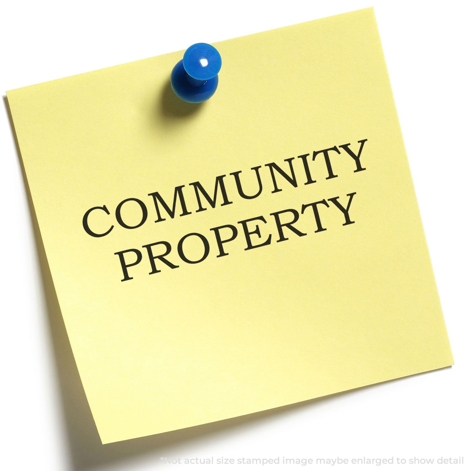 Pinned yellow note with blue pushpin stating Community Property for legal, real estate, and property documentation context.