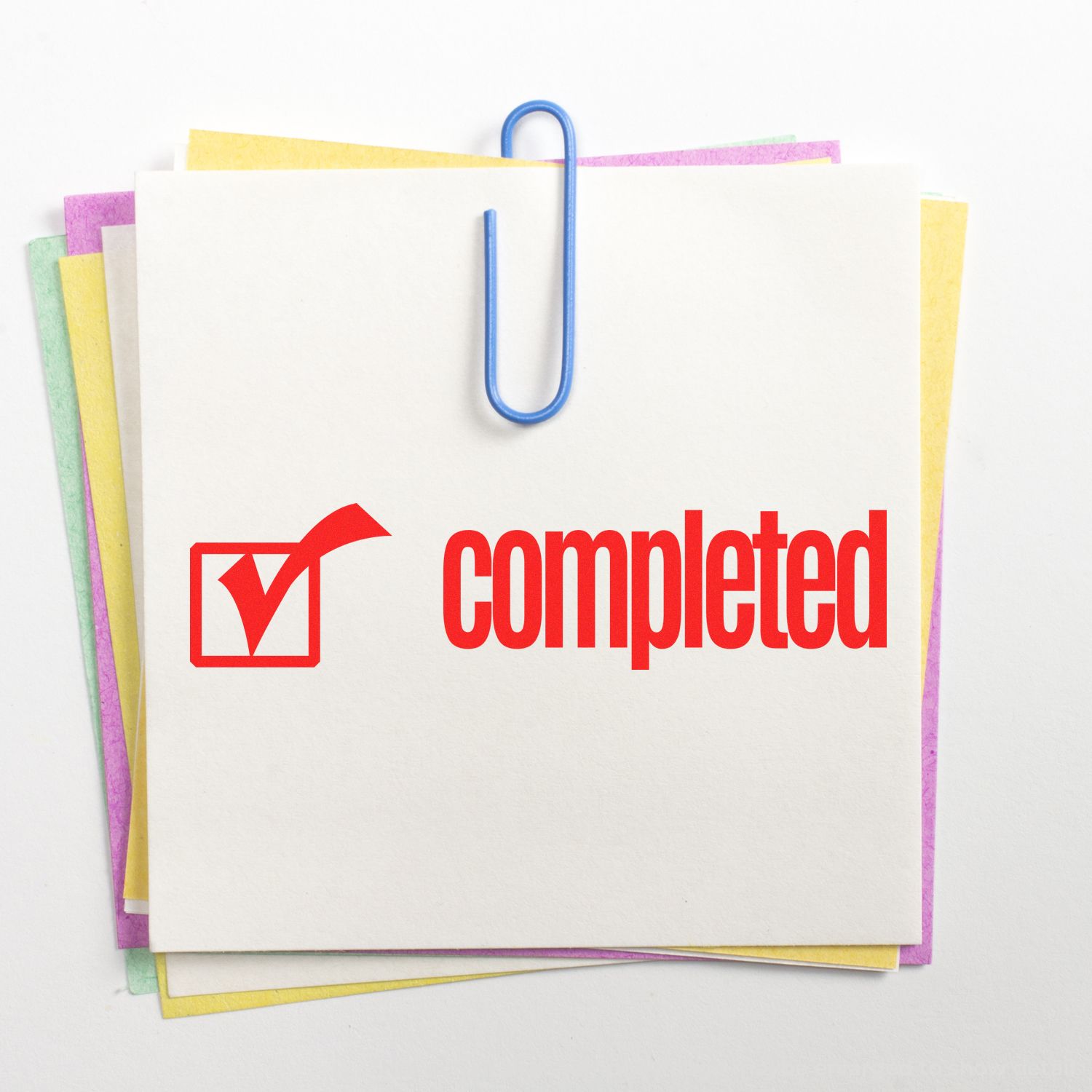 Completed paperwork with checkmark on stacked files and notes, representing task completion and document status.