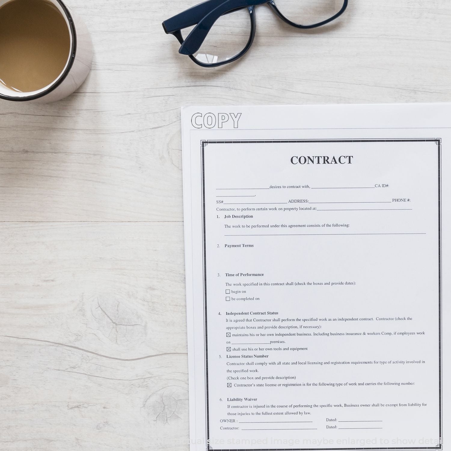 Contract agreement document on a desk with eyeglasses and coffee cup, business paperwork and legal form close-up.