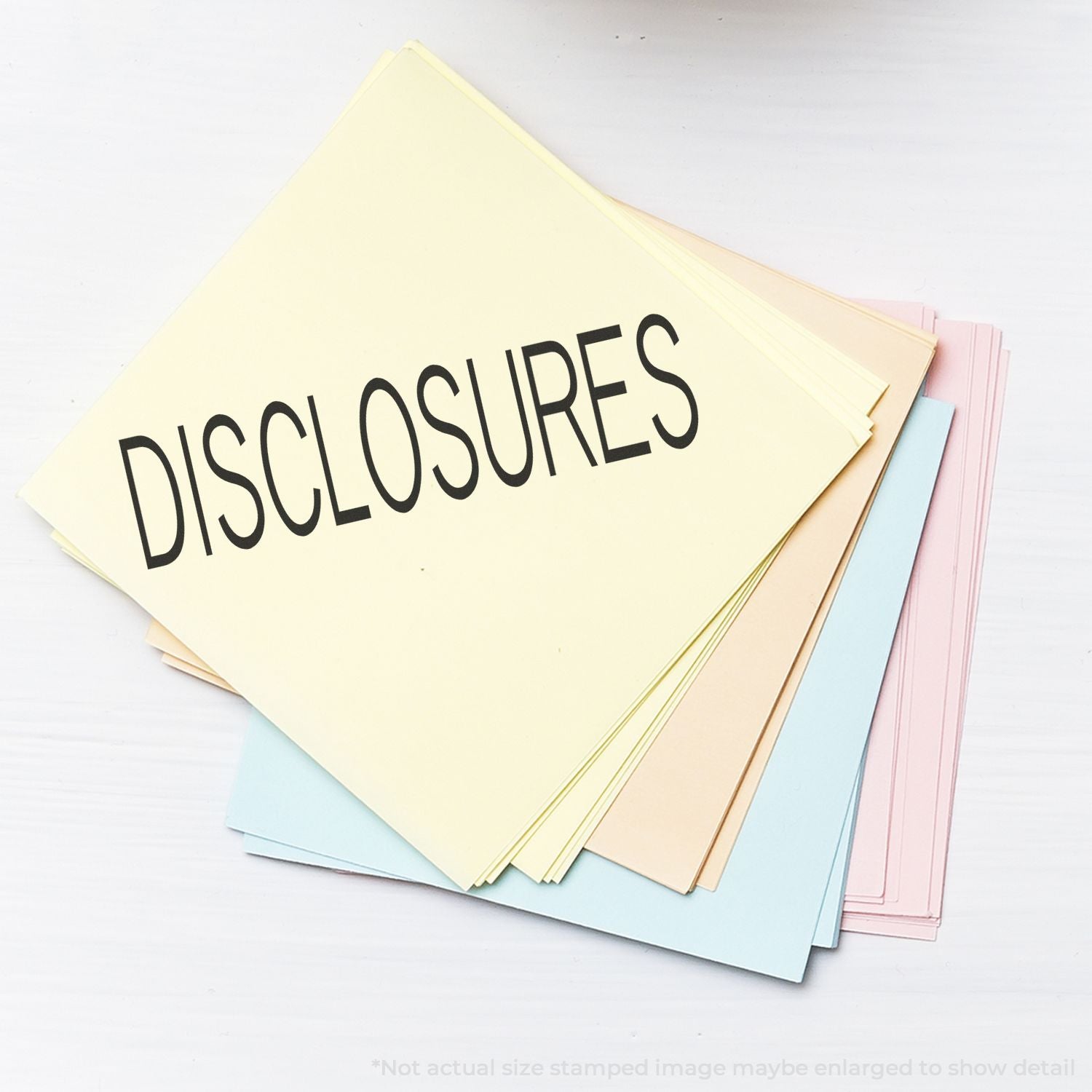 Stack of pastel disclosure documents with Disclosures text on a white background