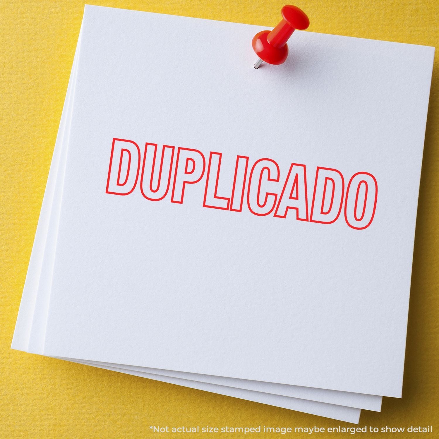 Red DUPLICADO stamp on white paper stack pinned with a red pushpin, indicating duplicate documents on a yellow background.