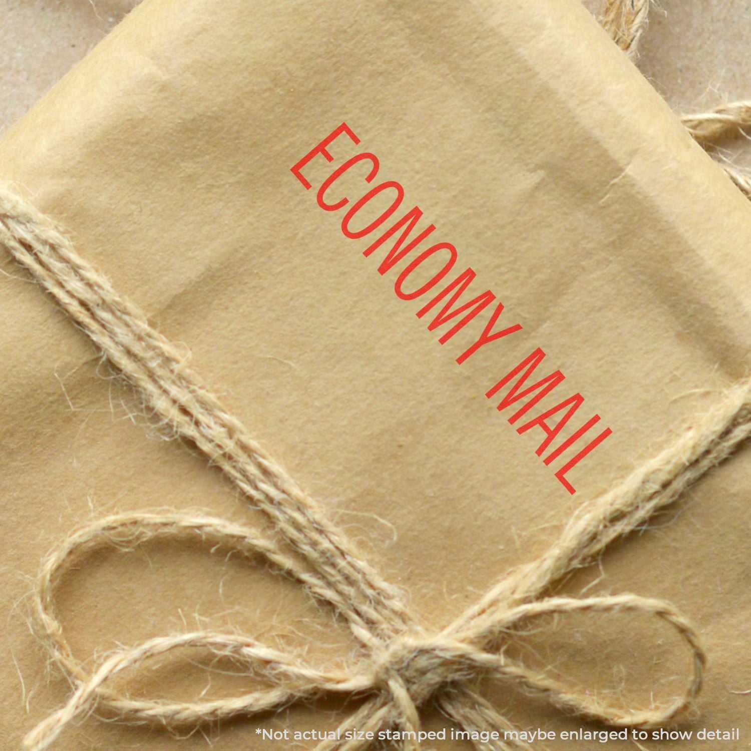 Brown kraft paper economy mail package tied with twine, close-up shipping parcel image