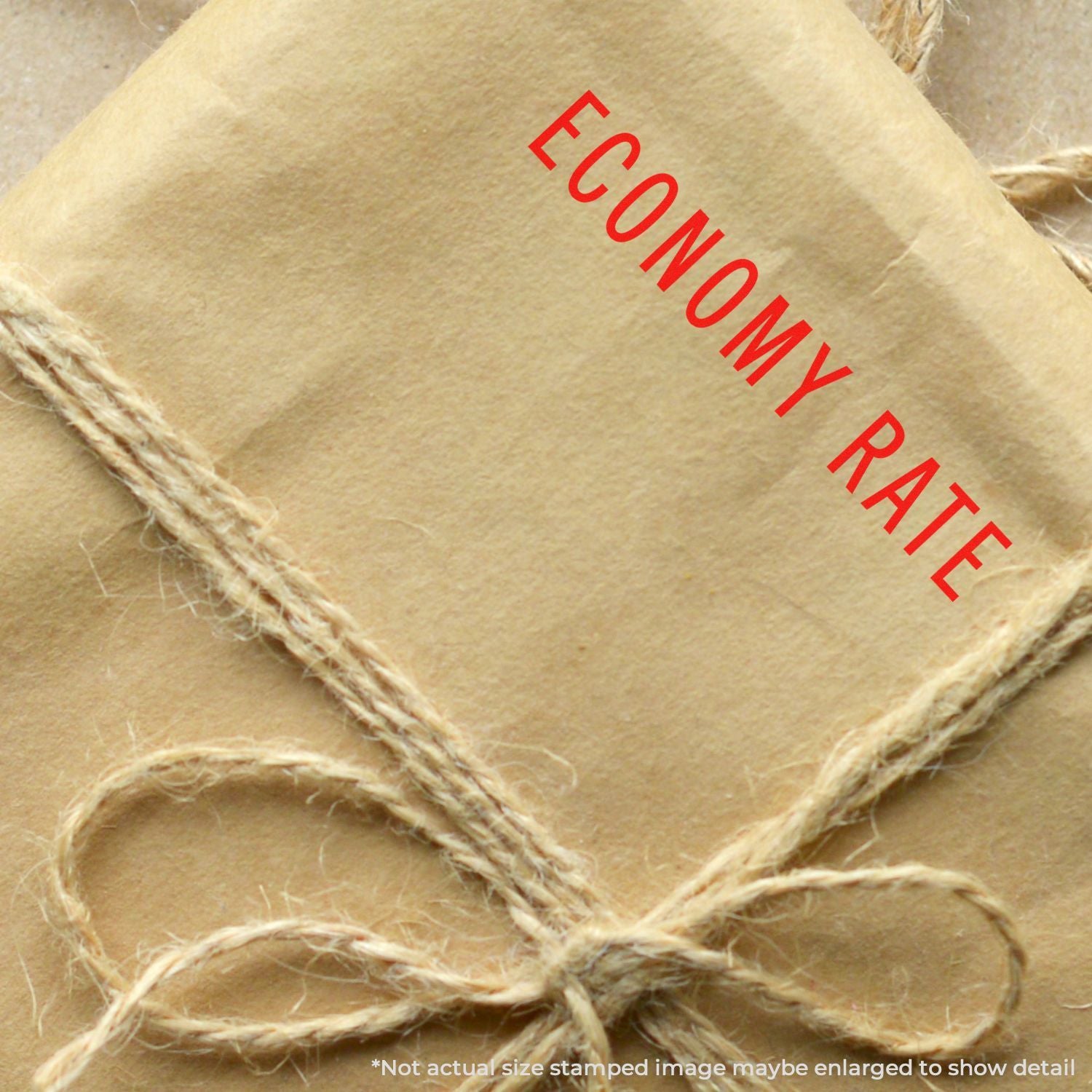 Red ENGLAND stamp on beige burlap fabric tag with jute twine, used for rustic gift wrapping and crafts.