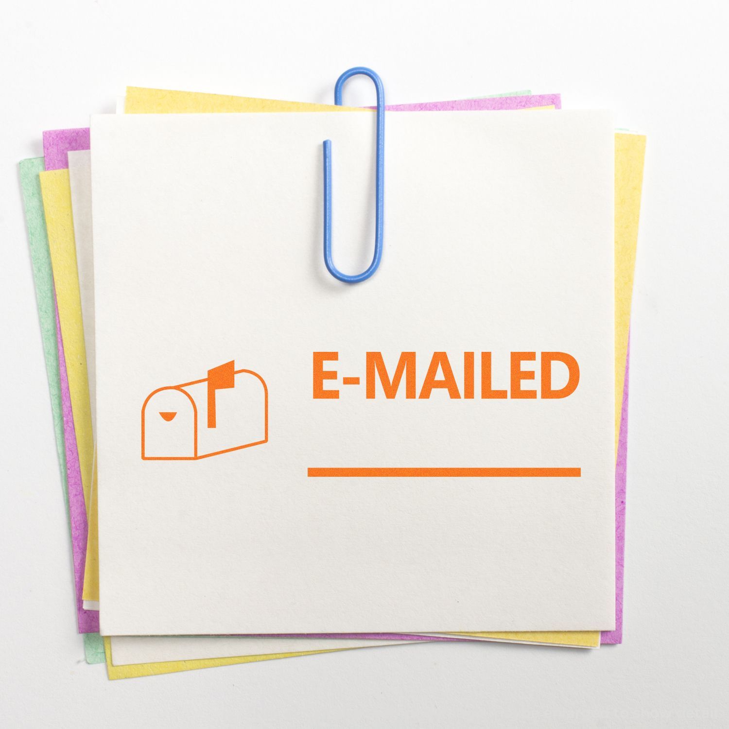 E-mailed notice on stacked colorful papers clipped with blue paperclip, office email status concept on white background