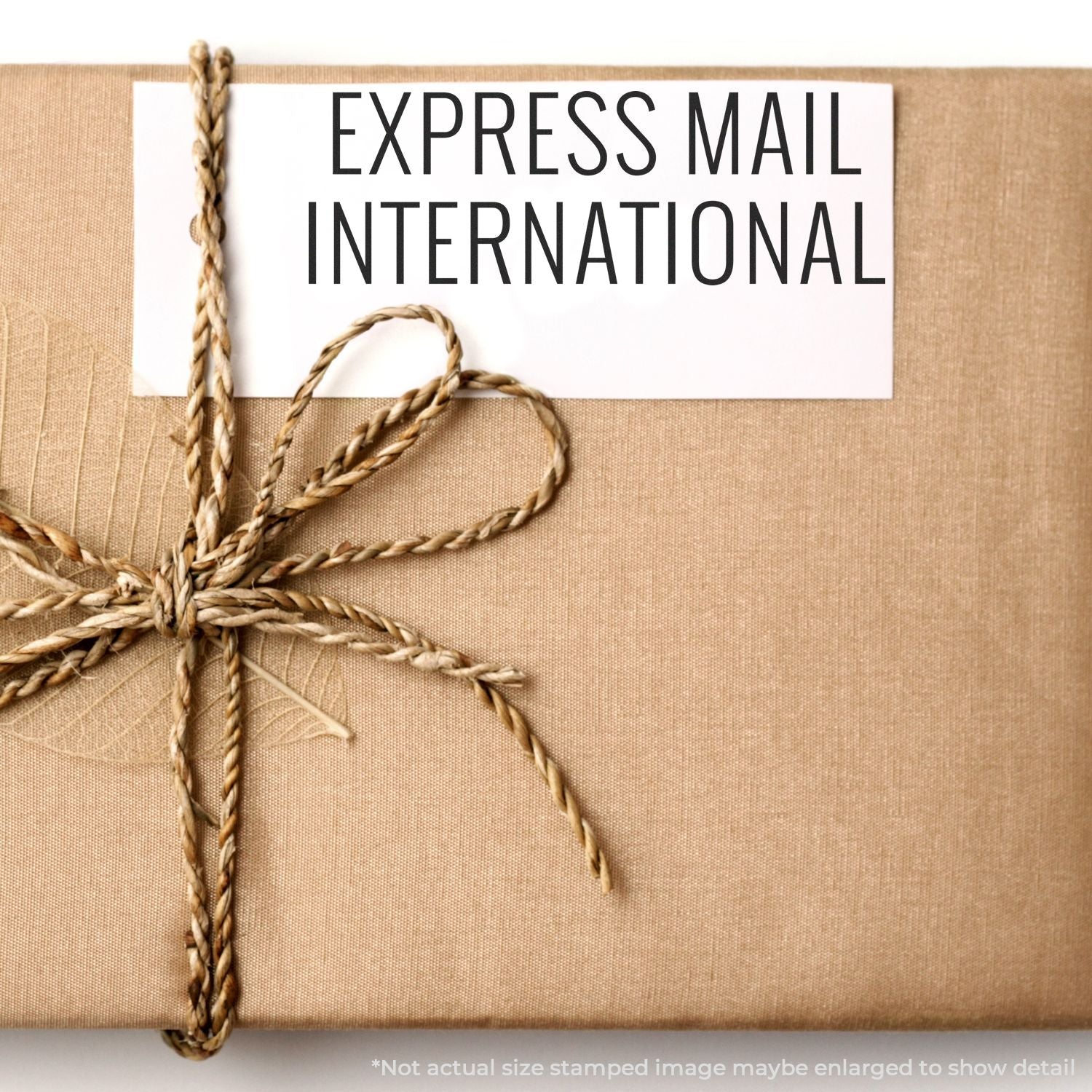 Express Mail International shipping label on tied cardboard package, showing fast global delivery service and postal tracking.