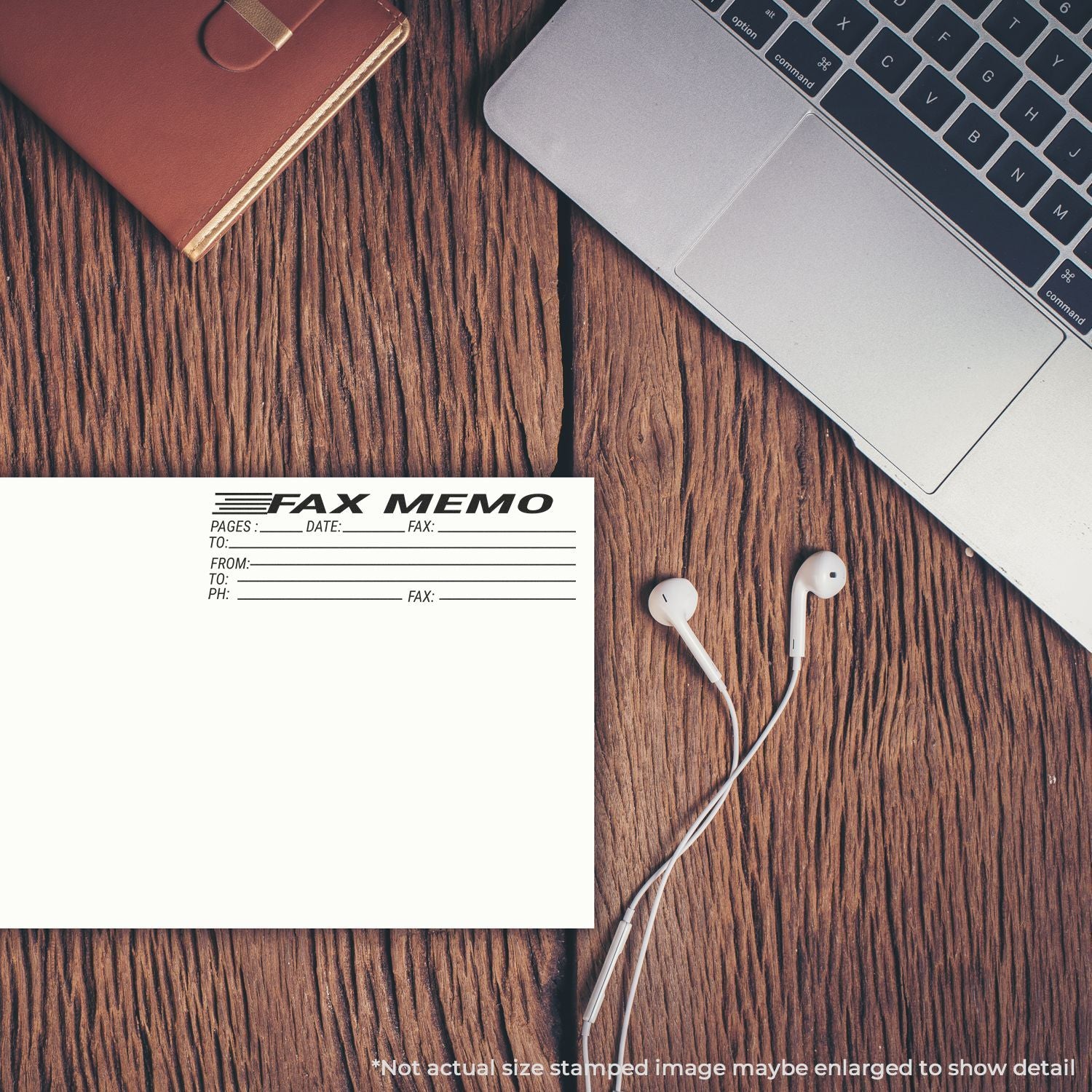 Fax memo form on wooden desk with laptop and wired earbuds, illustrating business document sending.