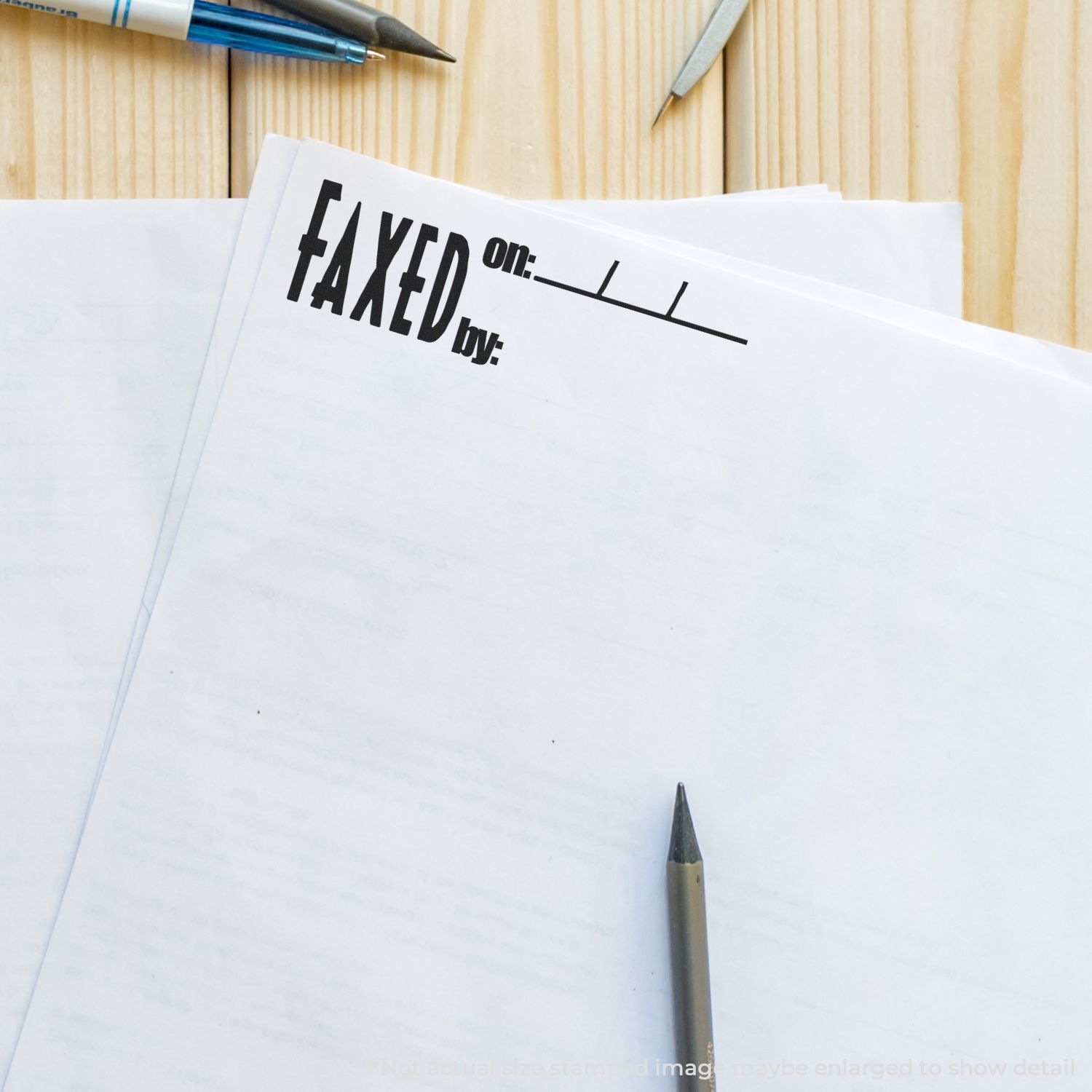 Close-up of printed sheet with FAKED text and office pens, illustrating the concept of fake documents.