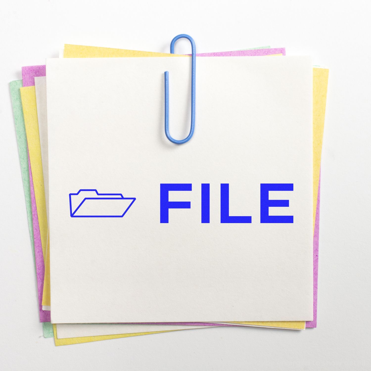 Stack of paper files with blue paperclip and FILE label, showing document organization and filing concept.