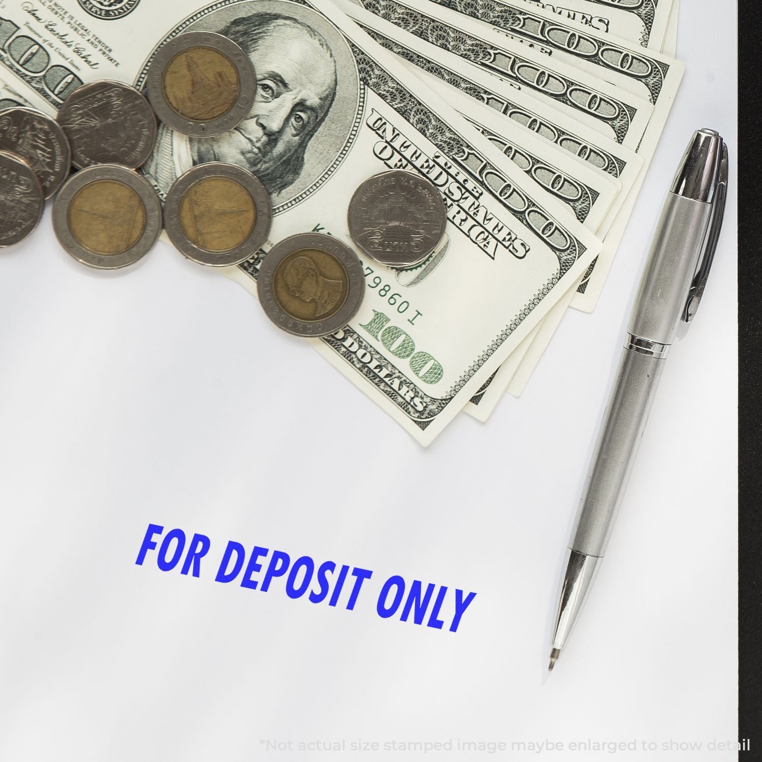 US $100 bills, coins and pen with For Deposit Only text, indicating a secure bank deposit or check payment processing.