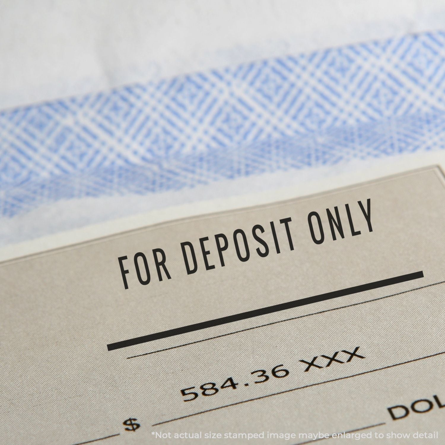 Close-up of a bank deposit slip reading For Deposit Only, helping ensure accurate check deposit processing and compliance.