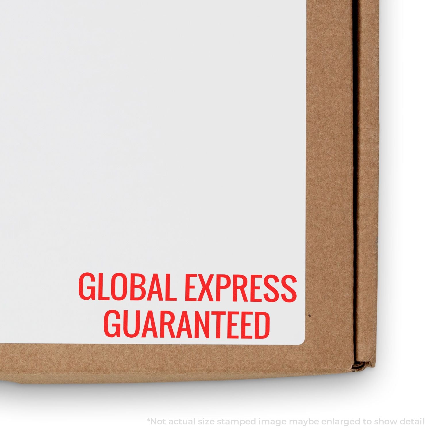 Close-up of cardboard shipping box with white label stamped Global Express Guaranteed for international express delivery.