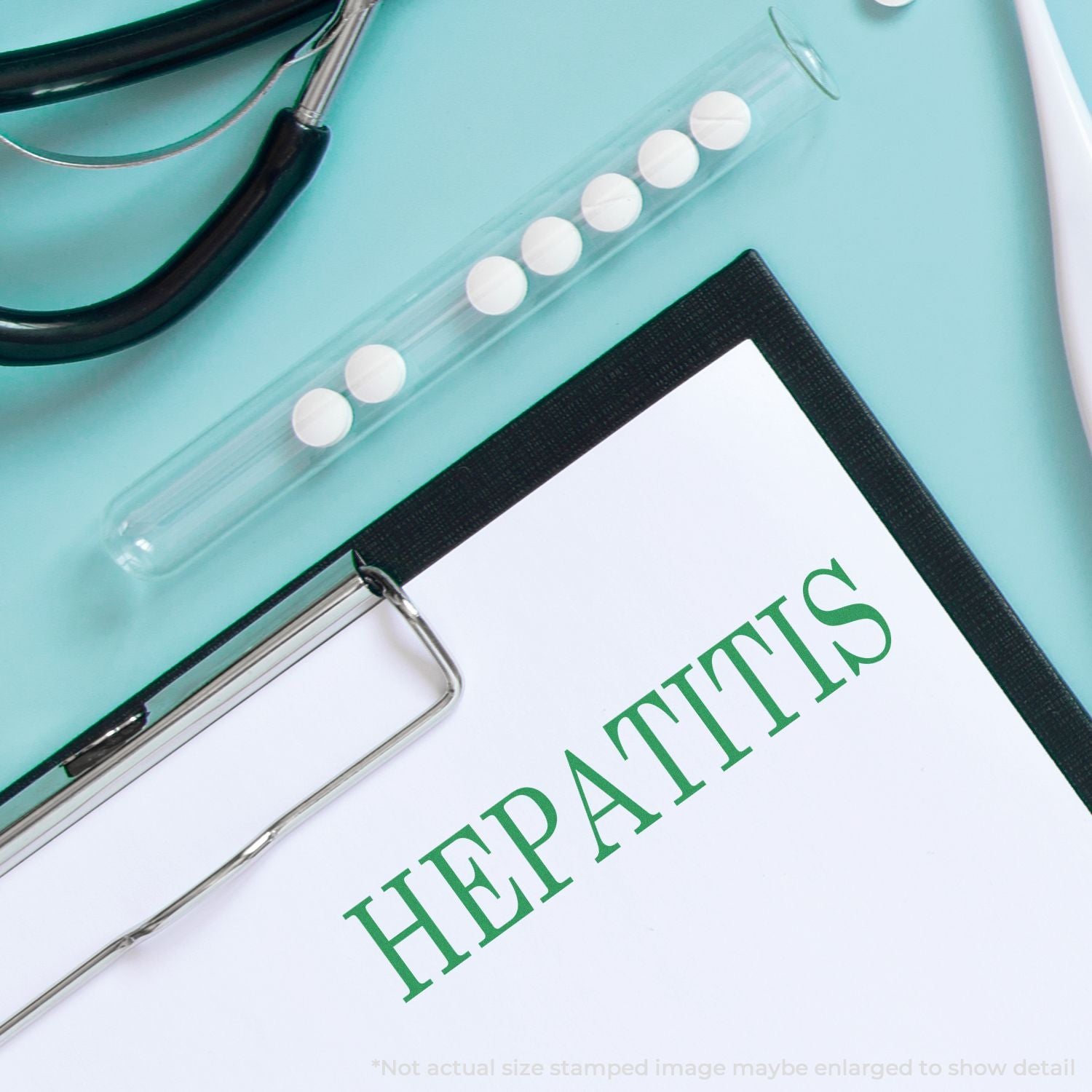 Hepatitis diagnosis concept with stethoscope, pills, and clipboard on a medical desk.