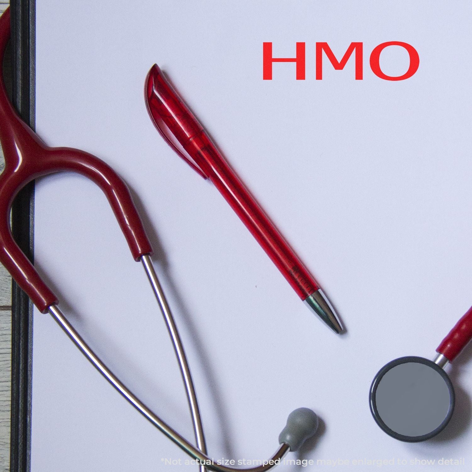 HMO medical equipment with red stethoscope, pen, and mirror on white background