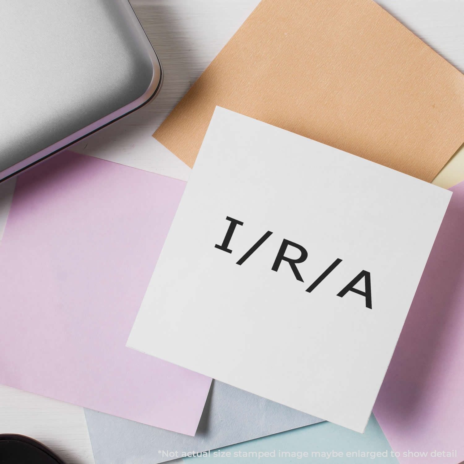 White stationery card reading HIRIA with colorful sticky notes on desk, branding and office paper supply concept