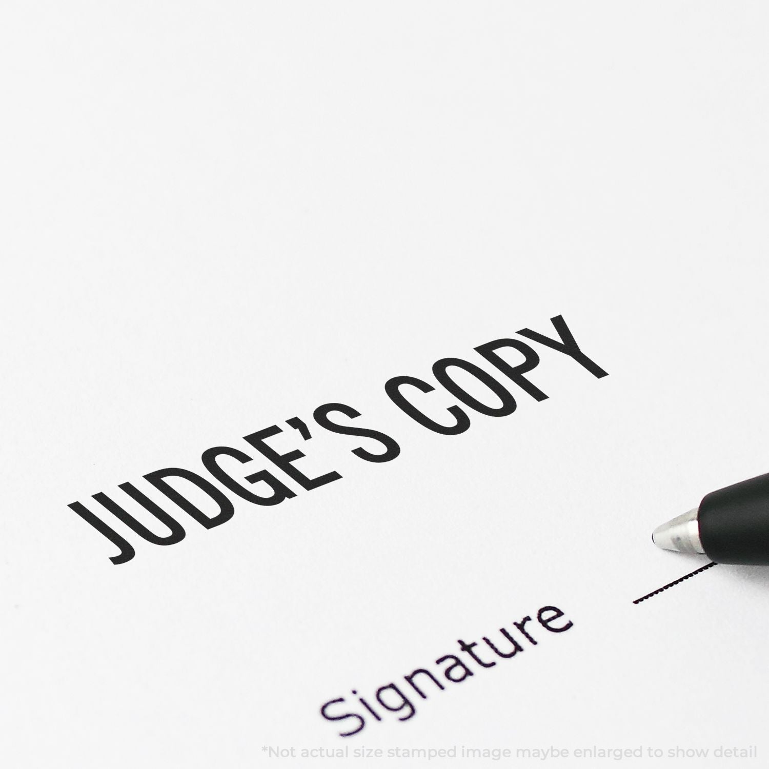 Judges copy document with signature line and pen, legal paperwork close-up.