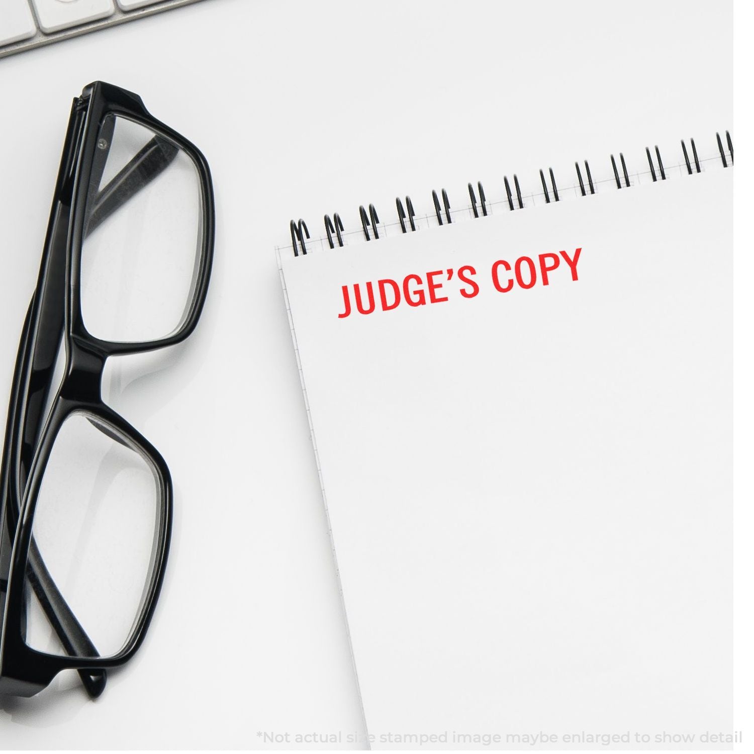 Judge's copy document with pen and eyeglasses, symbolizing court review and legal document handling.