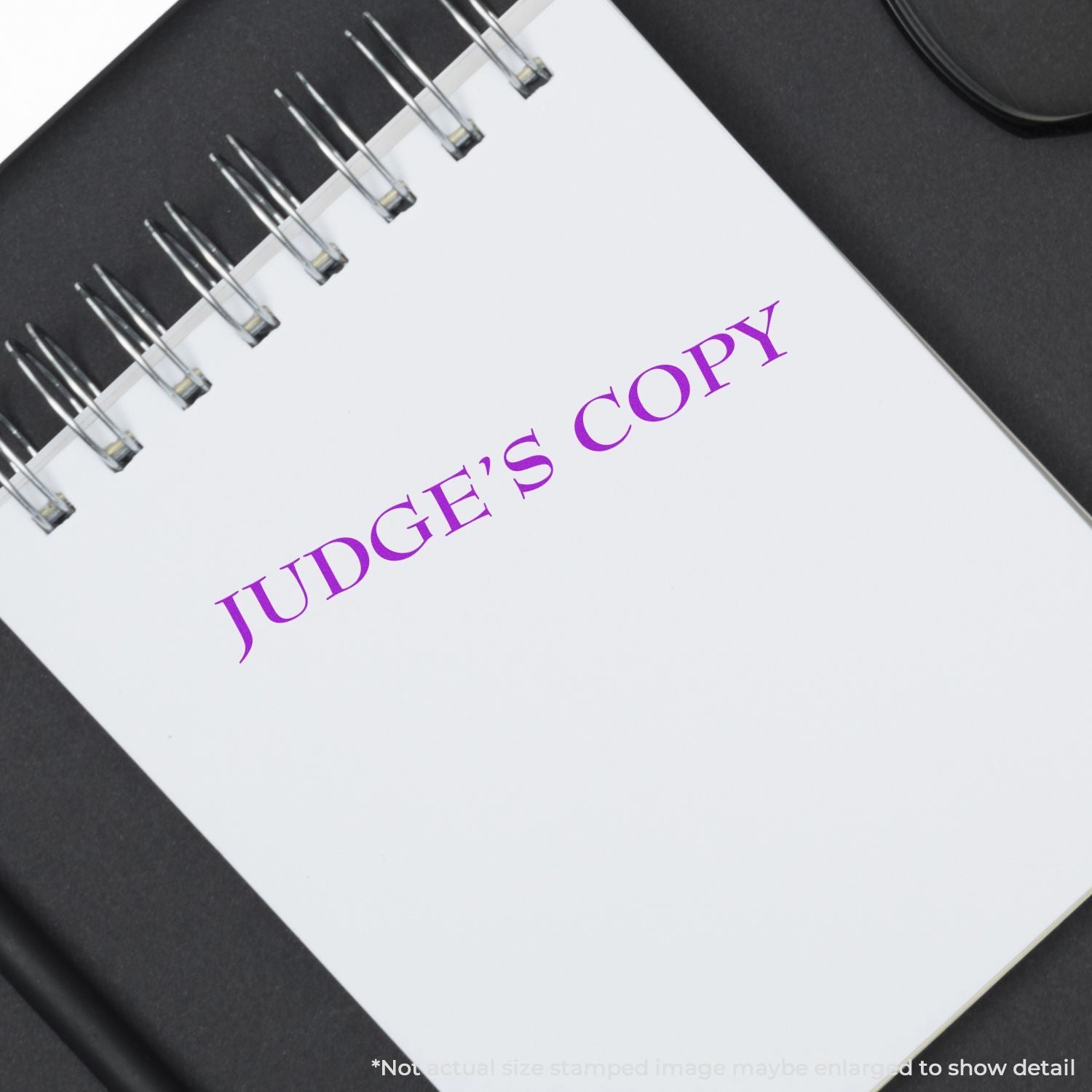 Judges copy notebook with purple JUDGE COPY title on spiral-bound legal document for court filings and review.