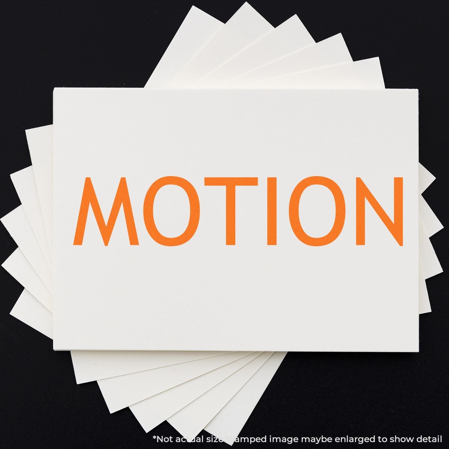 Stack of white cards with bold orange MOTION text on dark background, representing motion graphics or branding concept.