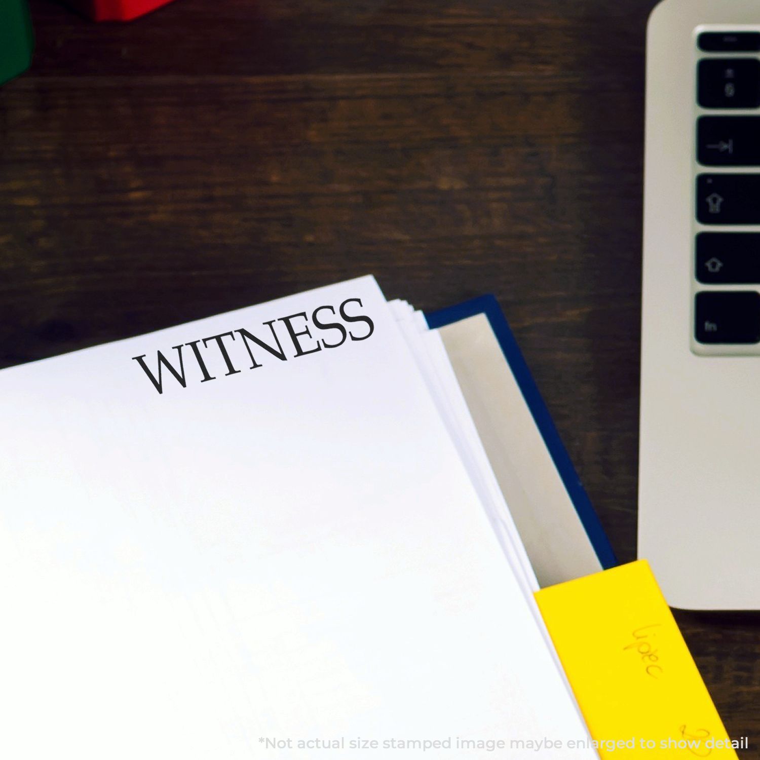 Witness document folder on a desk next to a laptop, legal paperwork for office or court use