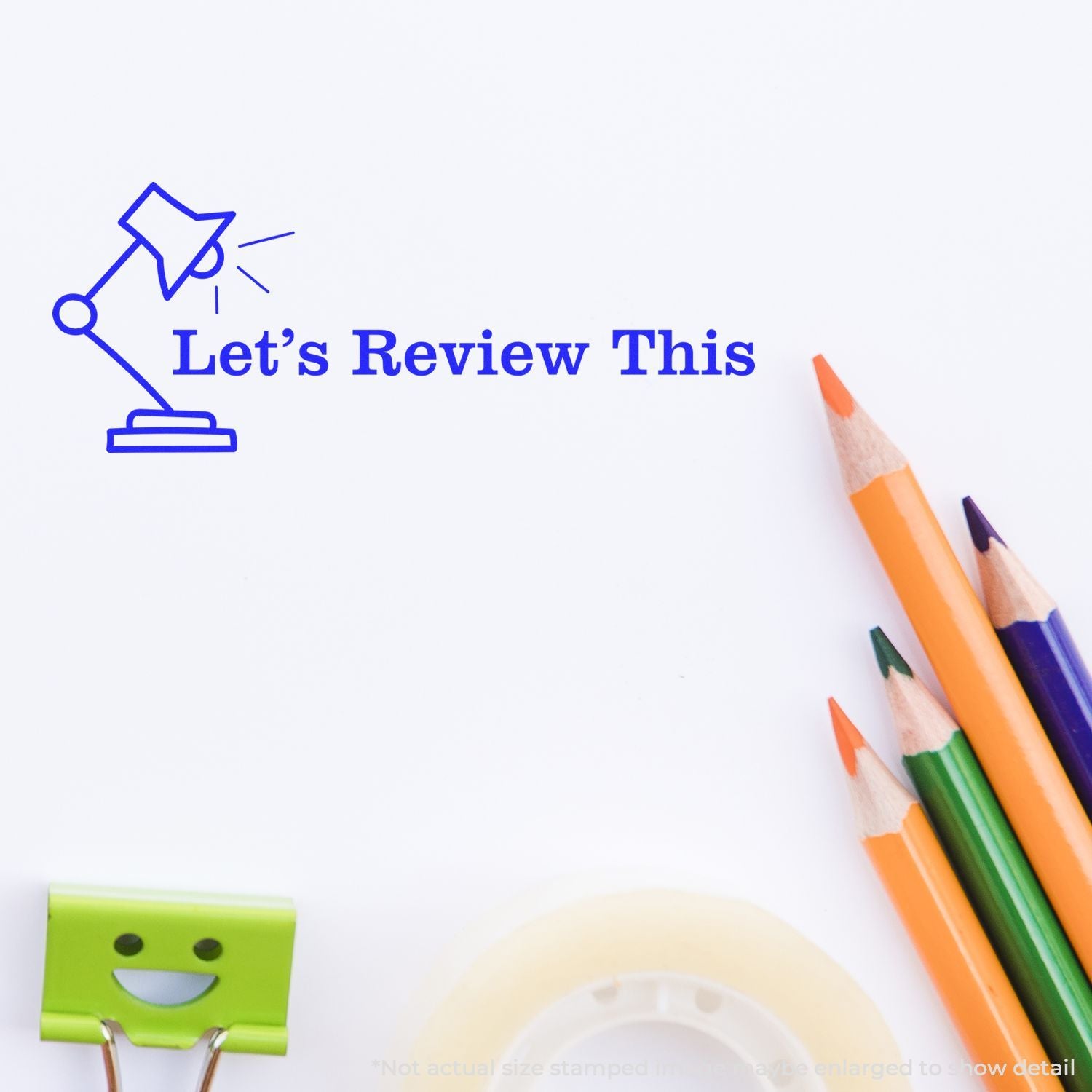 Lets Review This text with blue desk lamp icon, colorful pencils, and stationery on a white background for school and office review theme.