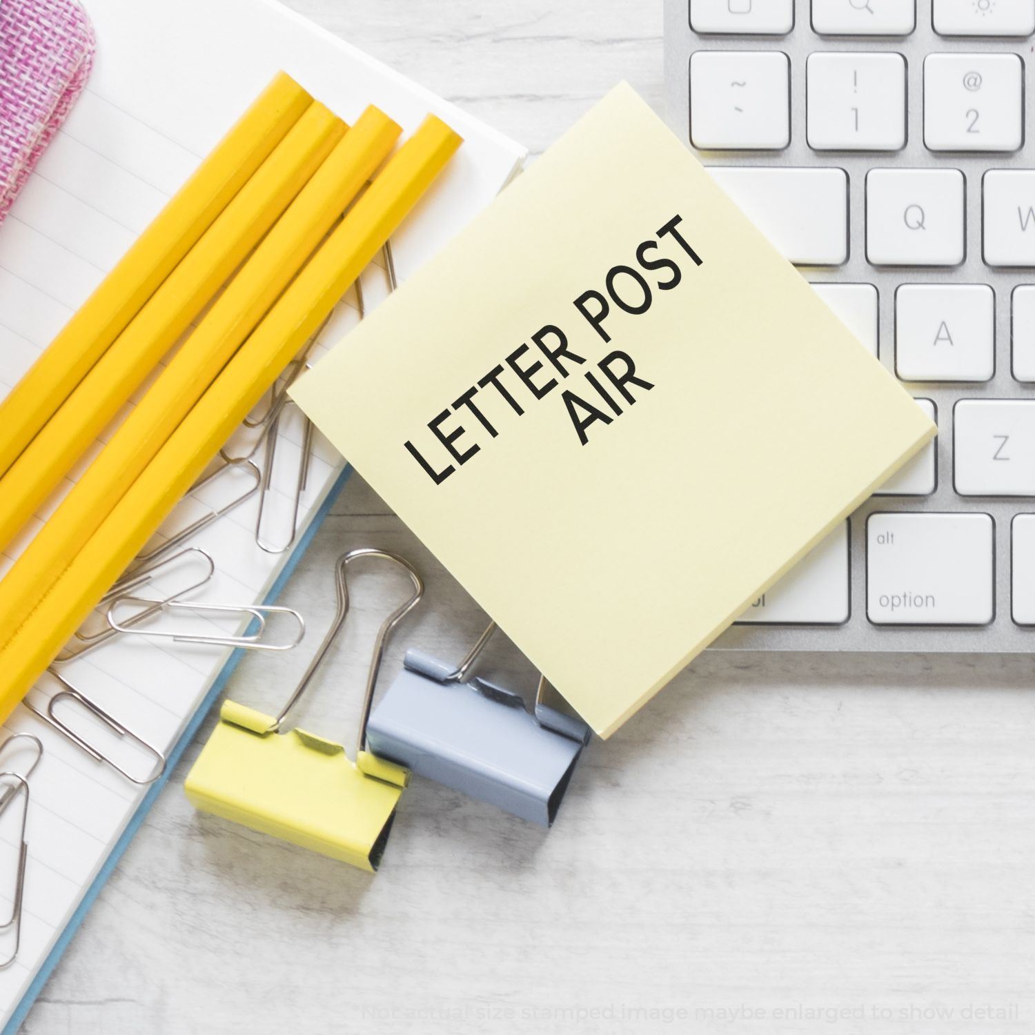 Stationery and keyboard with LETTER POST text, promoting letter writing and postal mail service marketing.