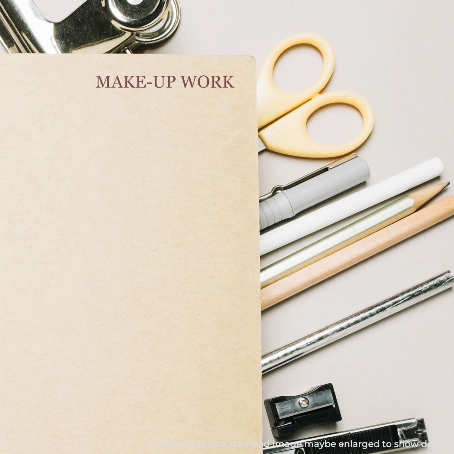 Make-up work desk with scissors, pencils, and tools beside a sheet labeled MAKE-UP WORK for beauty prep