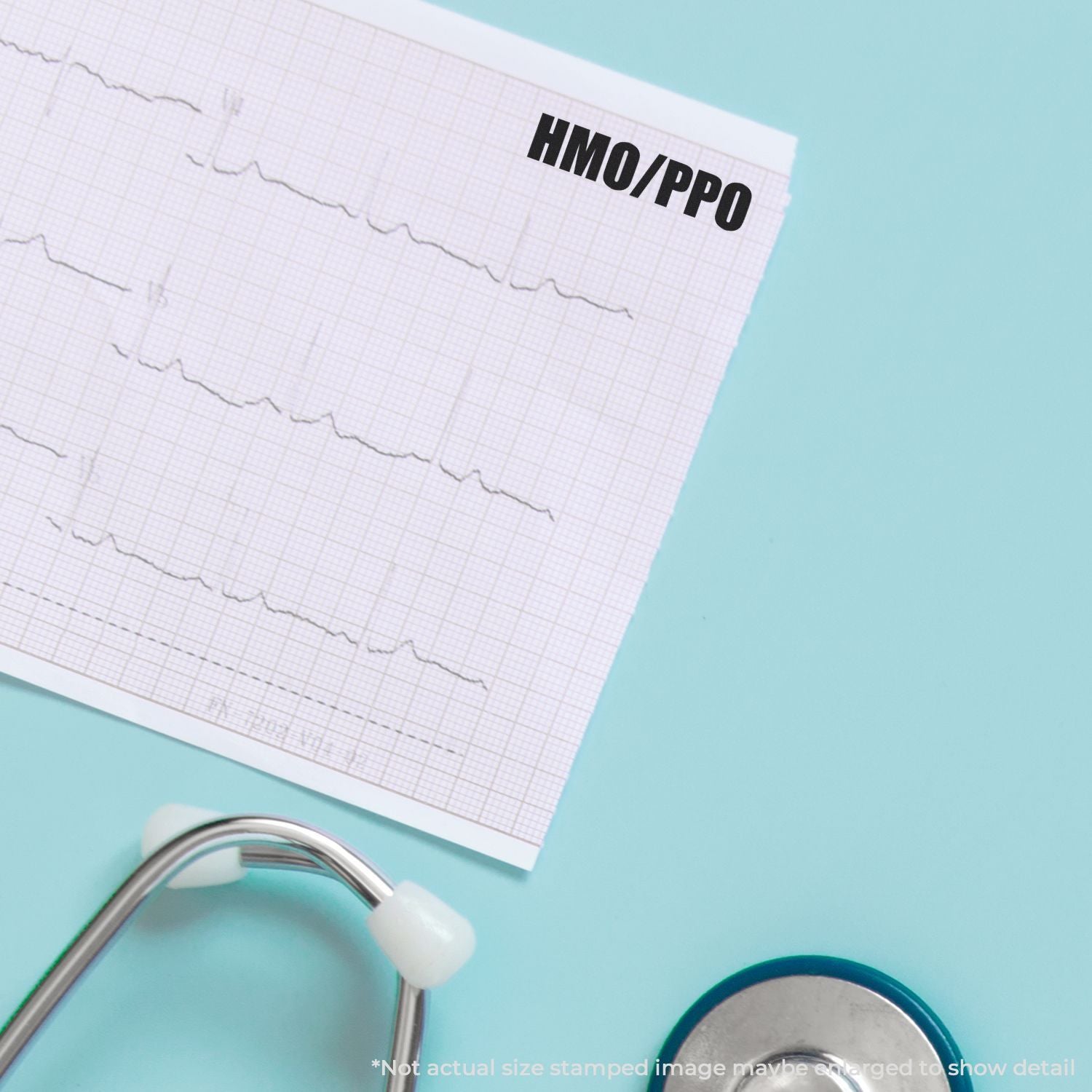 Close-up of ECG paper with HMO/PPo label and stethoscope on a blue background, cardiology and heart health concept.