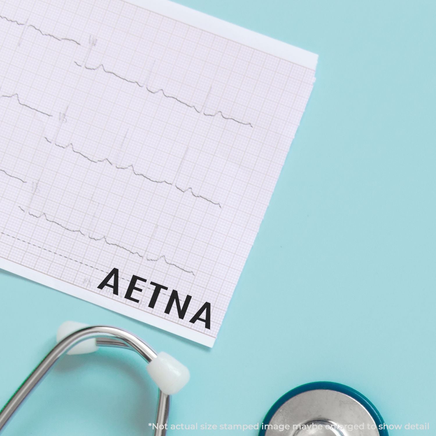 ECG test strip labeled AETNA with stethoscope, representing cardiac health monitoring and medical insurance care.