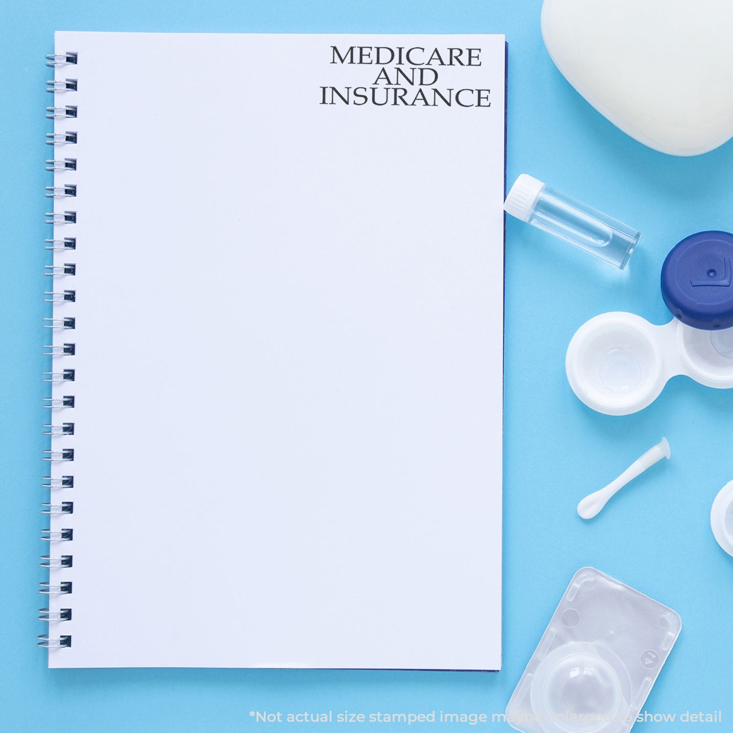 Medicare and insurance informational notebook with healthcare supplies on blue backgroundhealth coverage planning resource