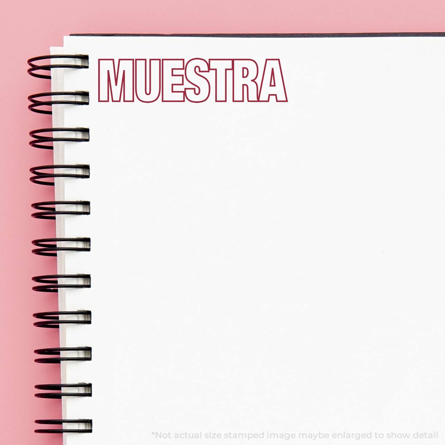 Spiral notebook cover titled MUESTRA, branding for a sample or template preview in a study or project.