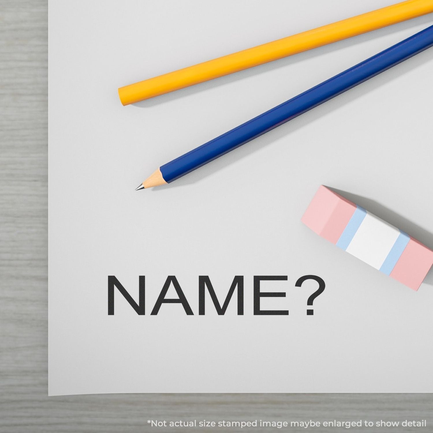 Color pencils and sticky notes with NAME? text, signaling an identity or name-writing prompt for school or forms.