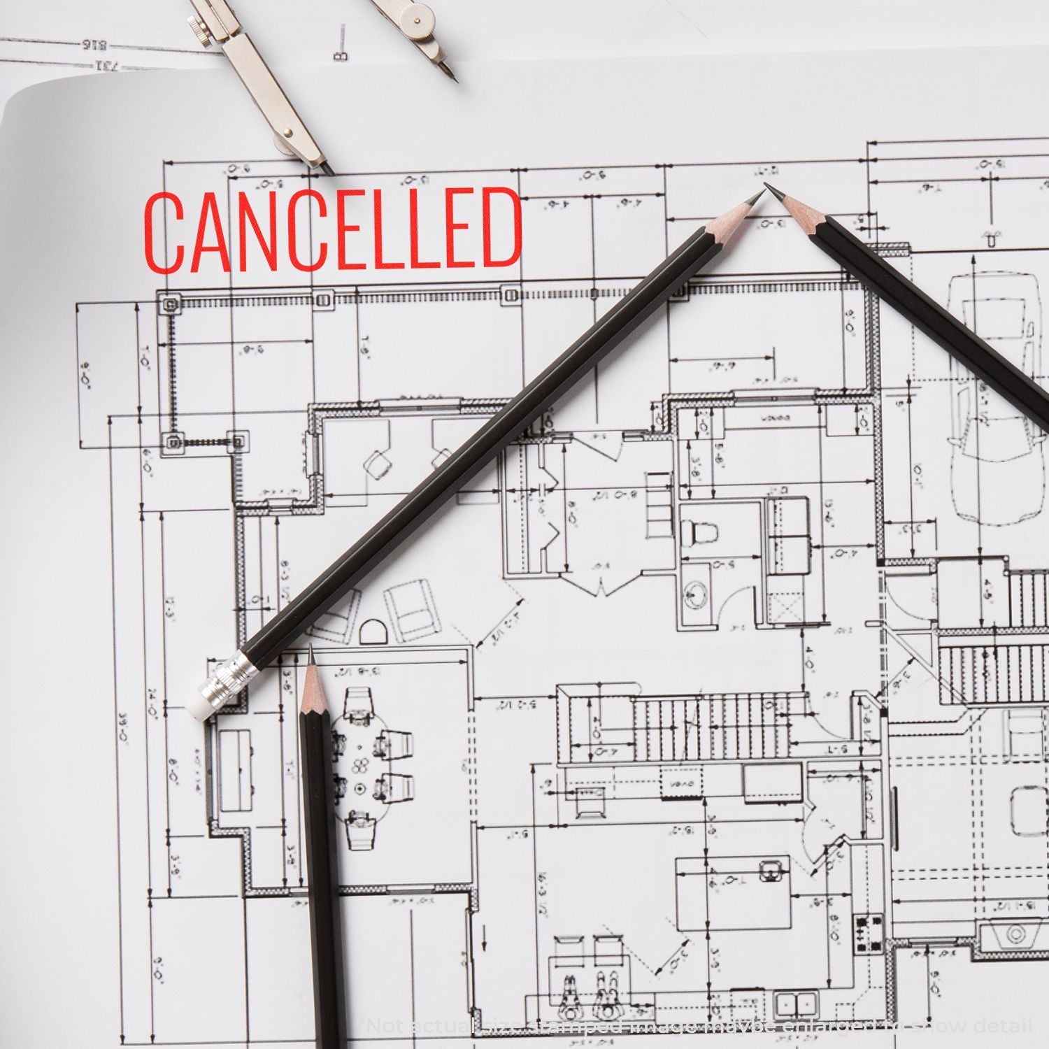 Cancelled building design blueprint with drafting tools and red CANCELLED text, showing a stopped architectural engineering project plan.